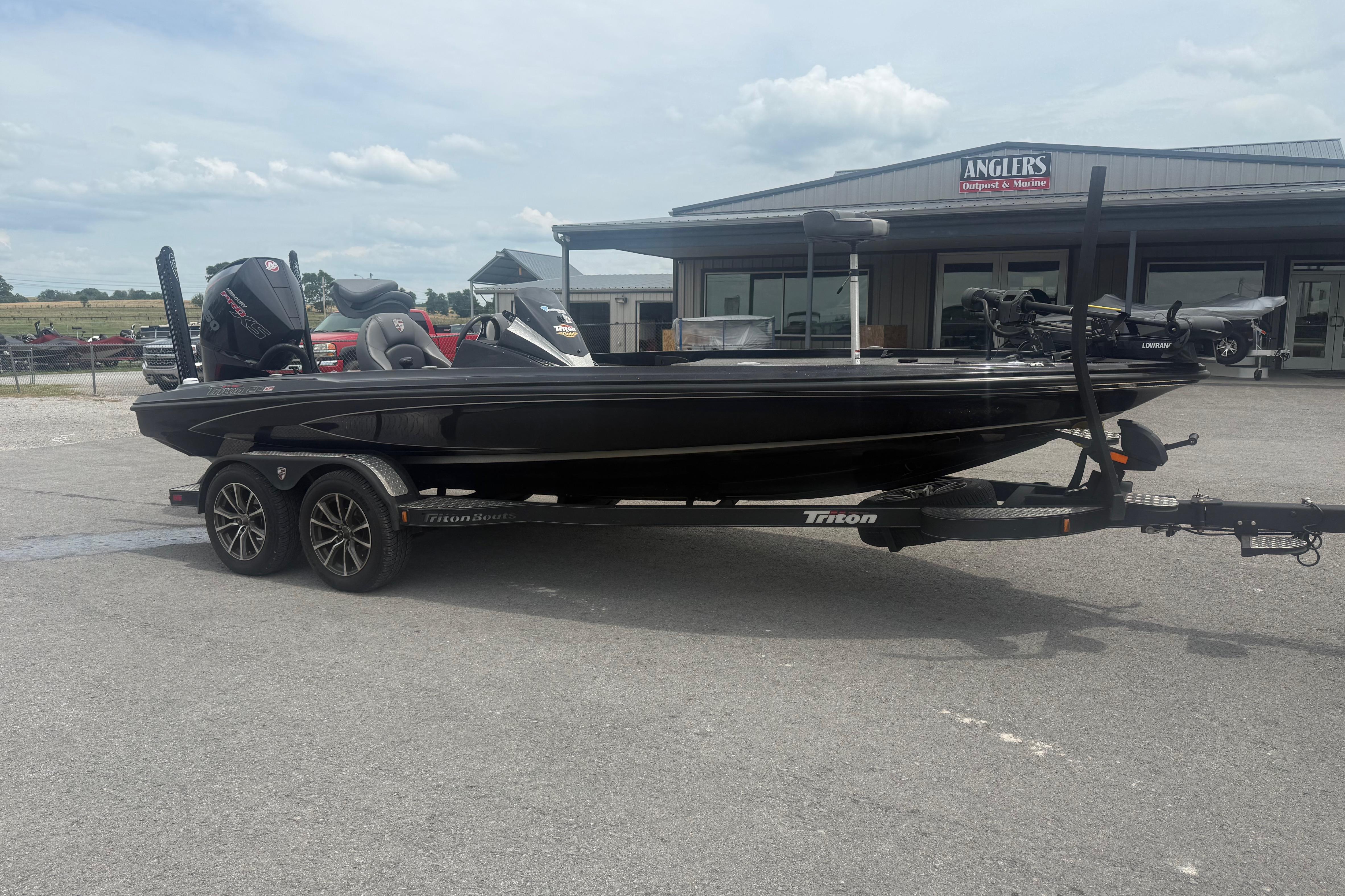 2024 Triton 20XP boat on trailer, parked outside Angler's Outpost & Marine.