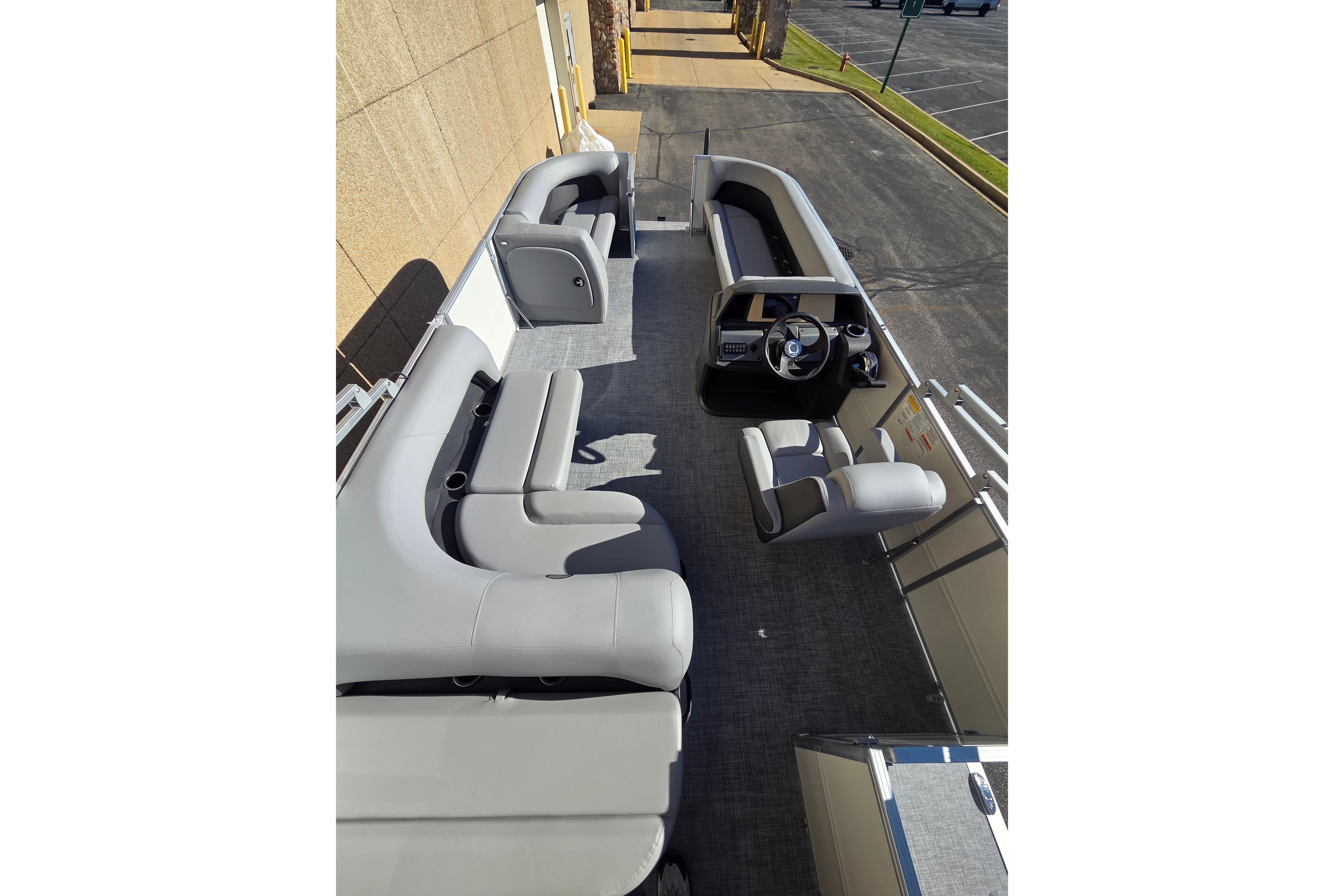 2026 Sun Tracker Party Barge 18 DLX interior with spacious seating and modern helm.