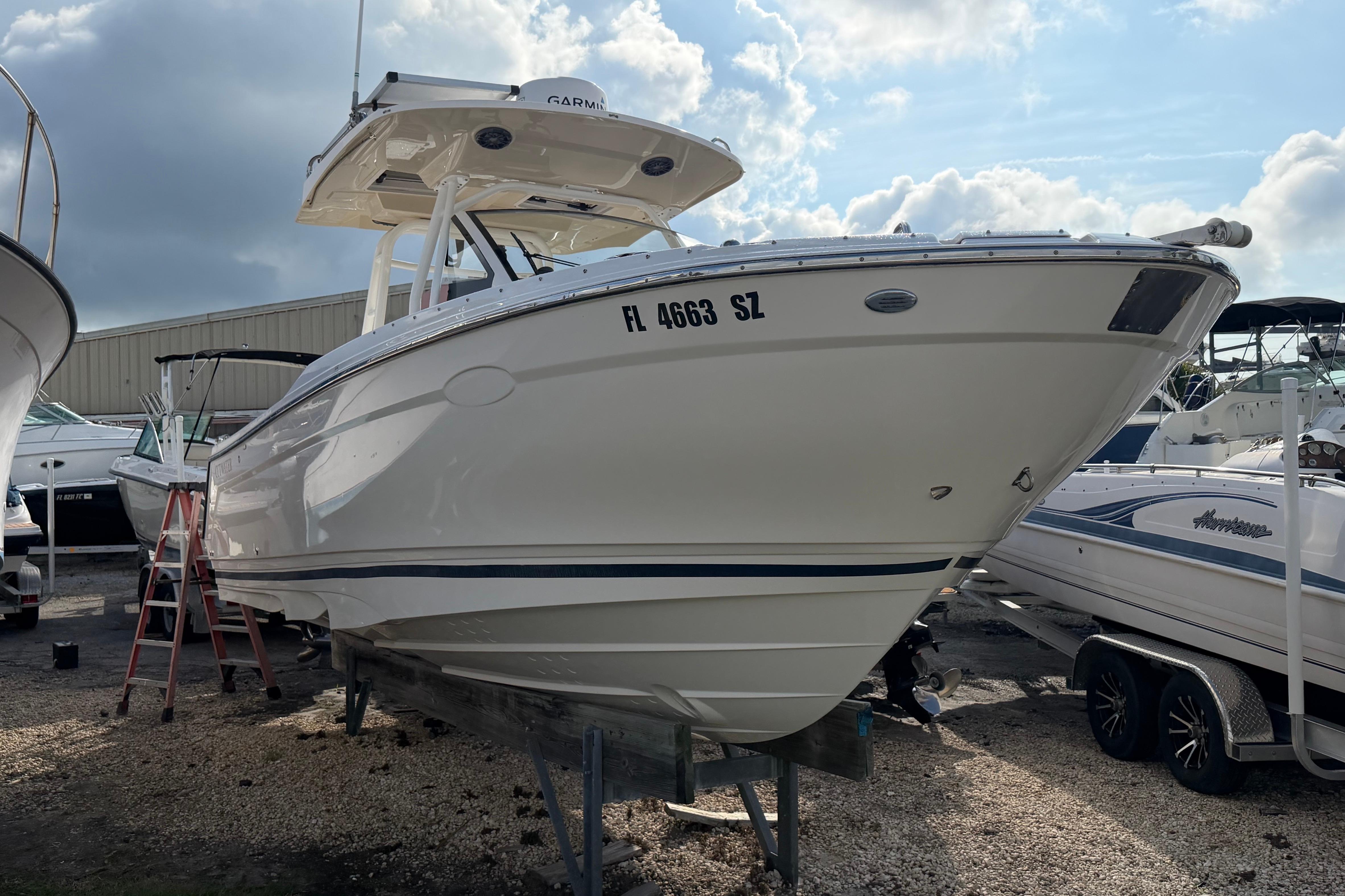 2020 Solara S-250 CW boat on dry dock under cloudy sky.
