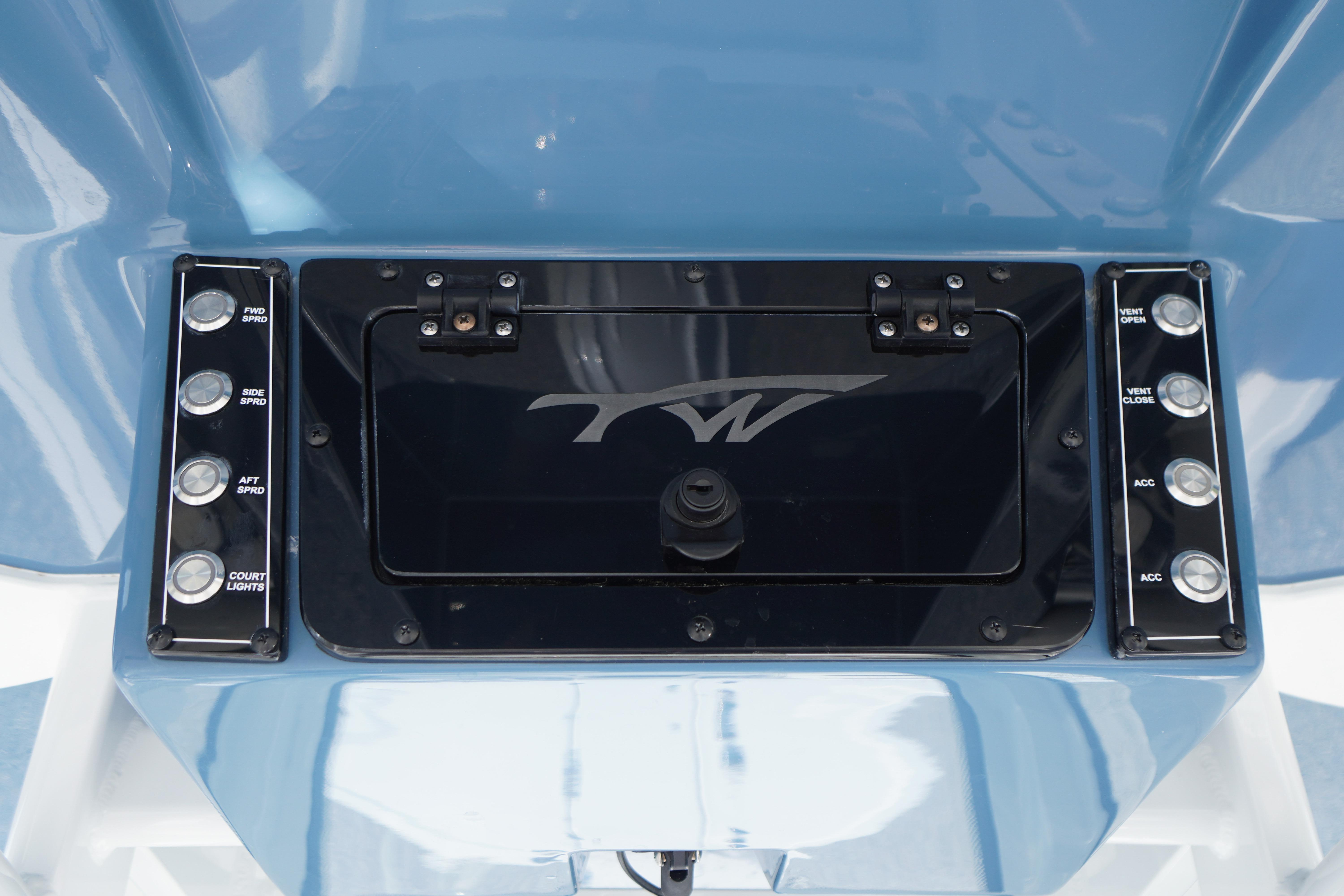 Control panel of 2025 Tidewater 232 SS boat with labeled buttons and logo.