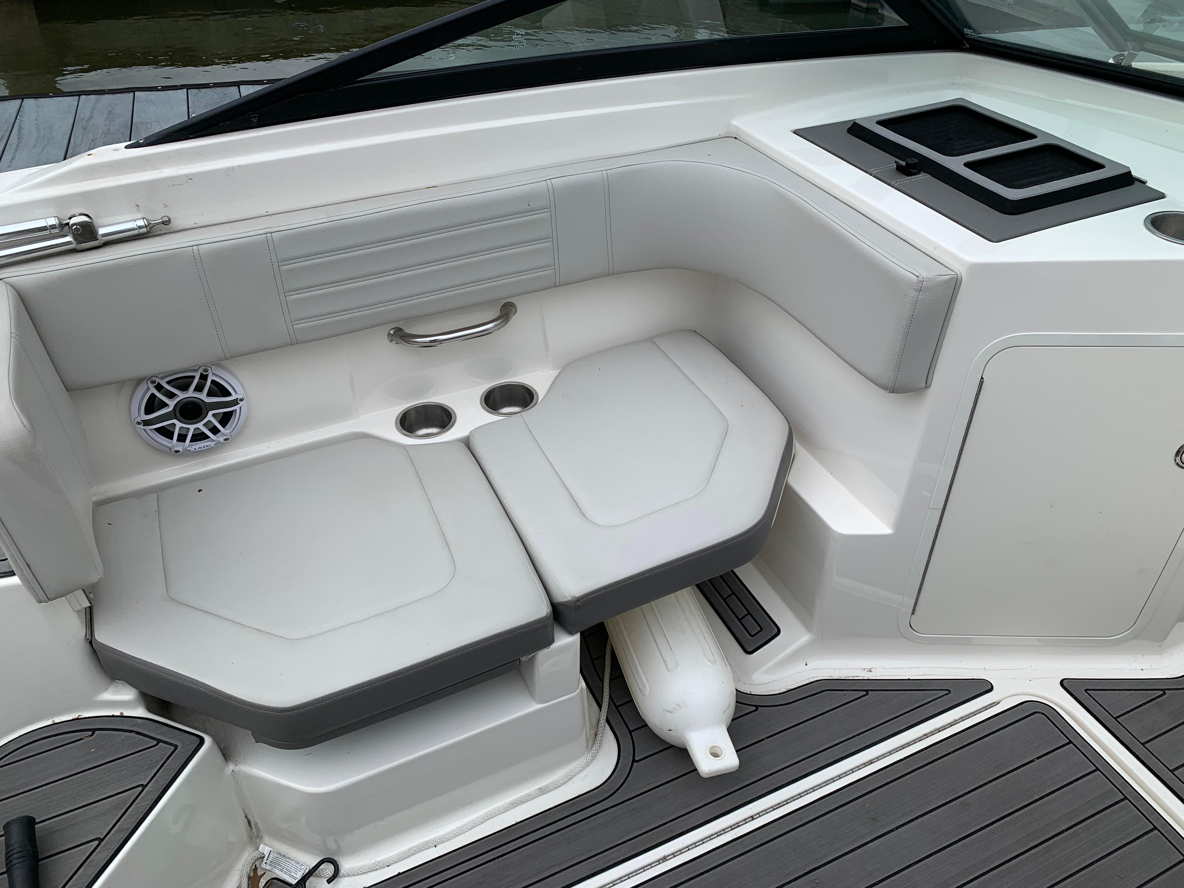 2020 Sea Ray SPX 190 Outboard boat interior with cushioned seating and cup holders.