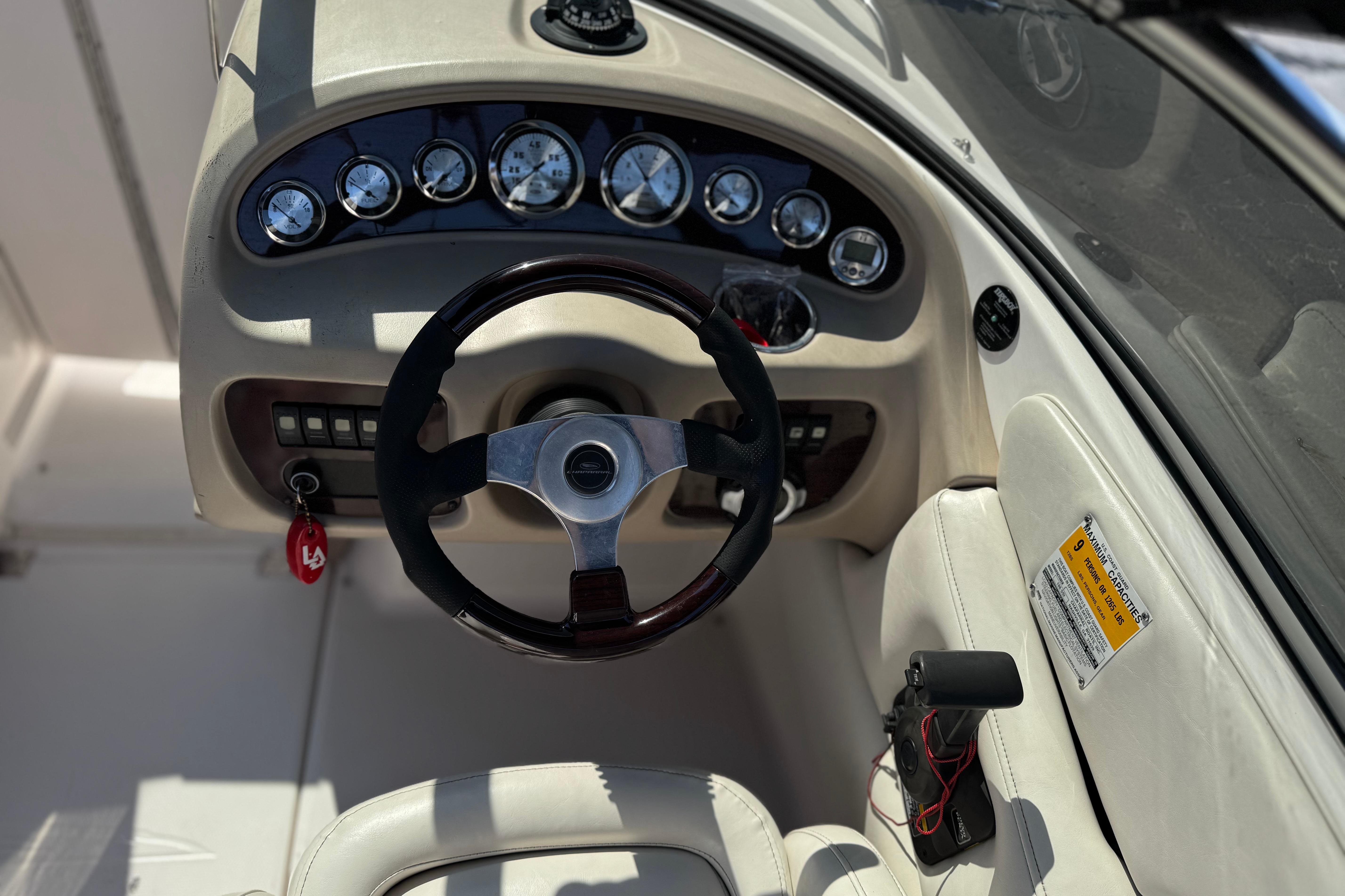 2002 Chaparral 186 SSi boat dashboard with steering wheel and instrument panel.
