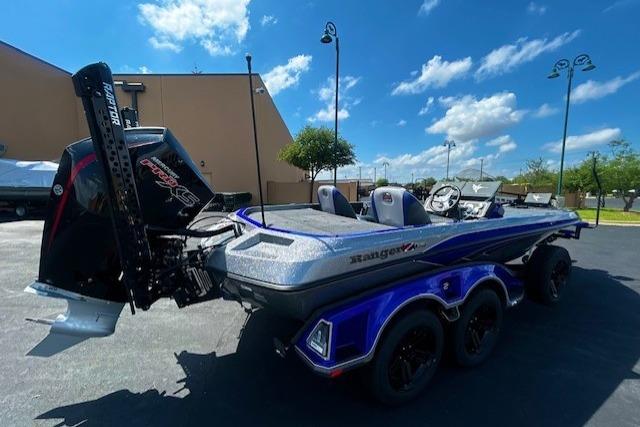 2026 Ranger Z521 boat with powerful outboard motor, parked outdoors under a clear blue sky.