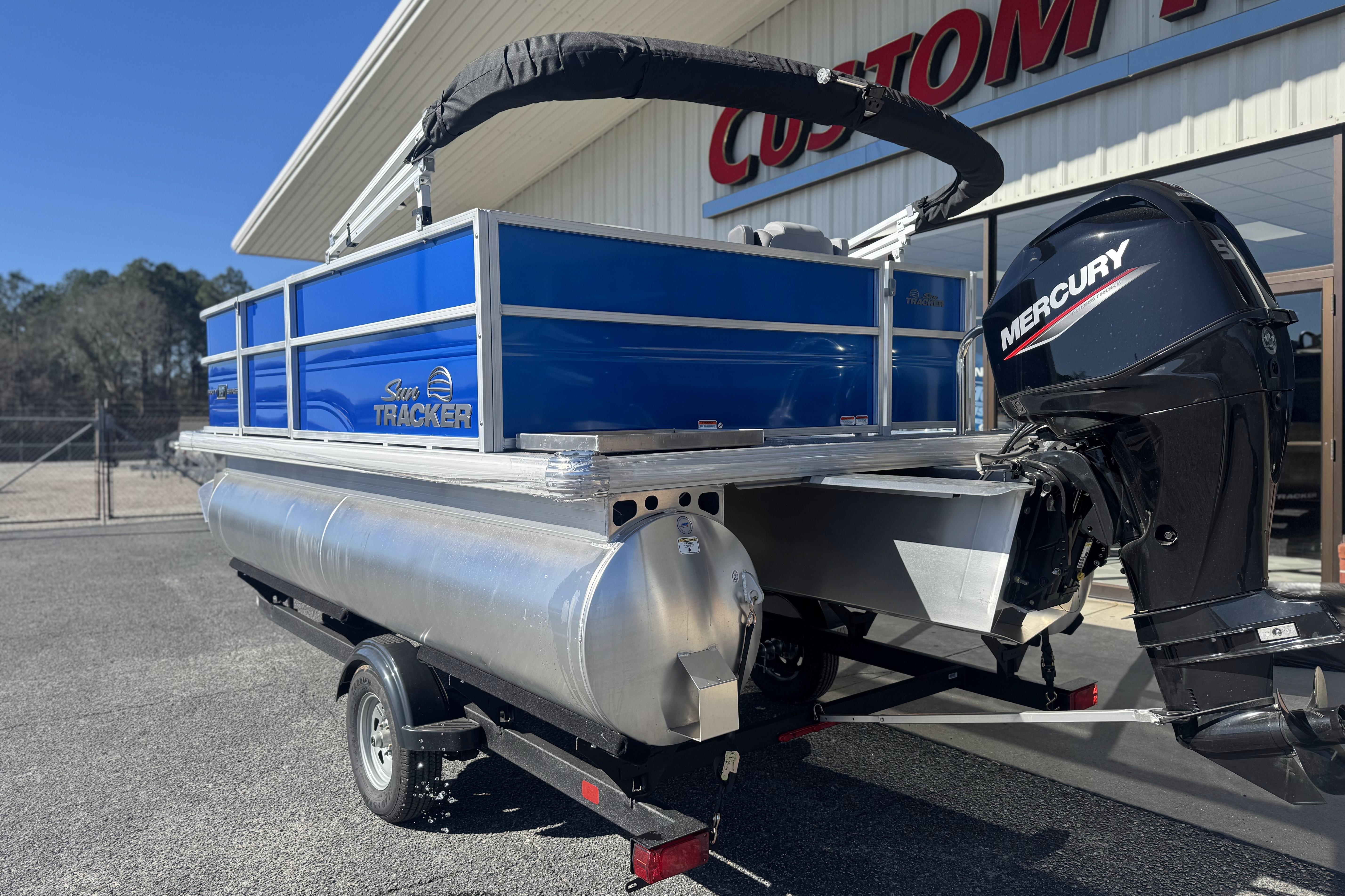 2026 Sun Tracker Party Barge 16 DLX pontoon boat with Mercury outboard motor.