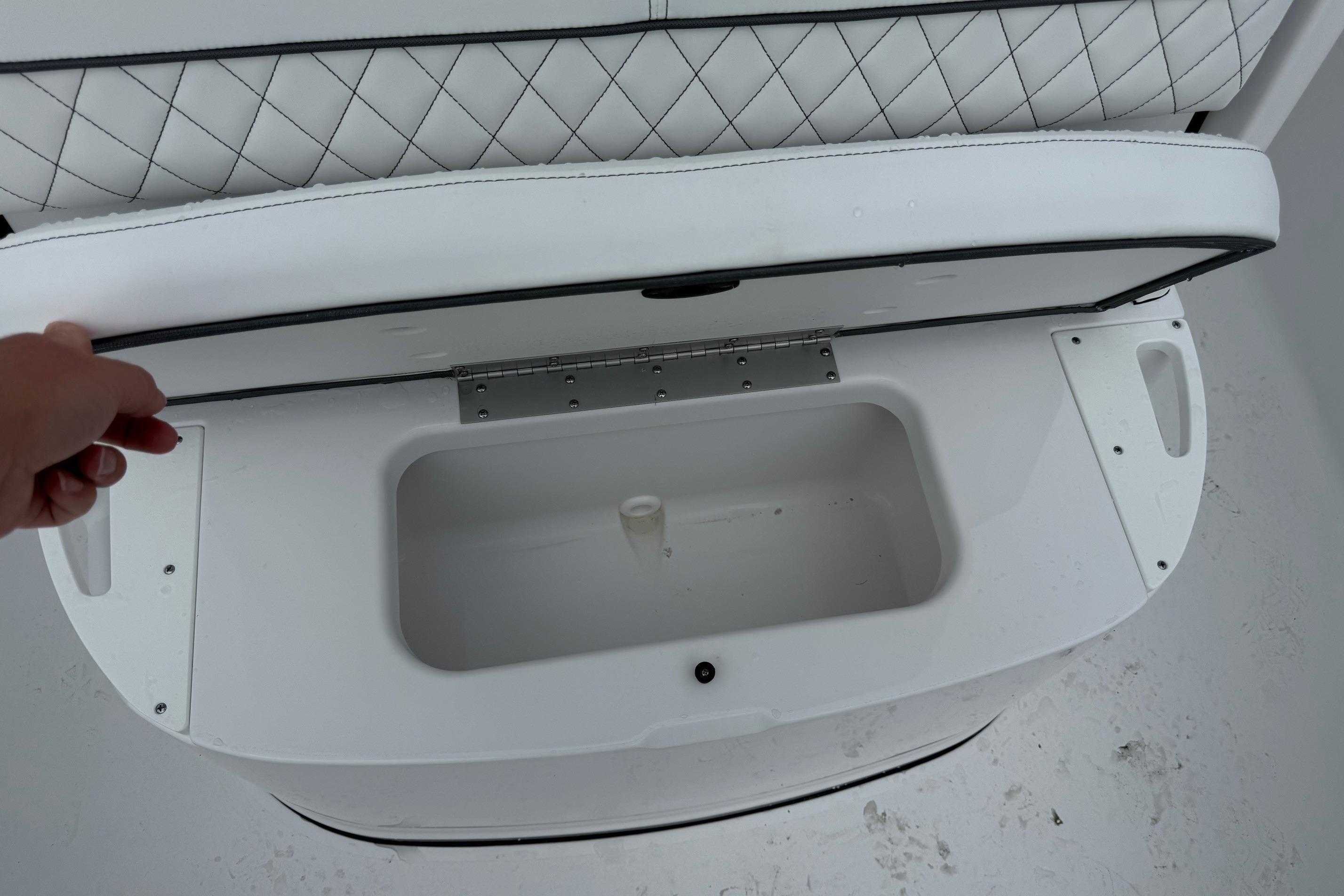 Open storage compartment on 2026 Sportsman Heritage 231 Center Console boat.