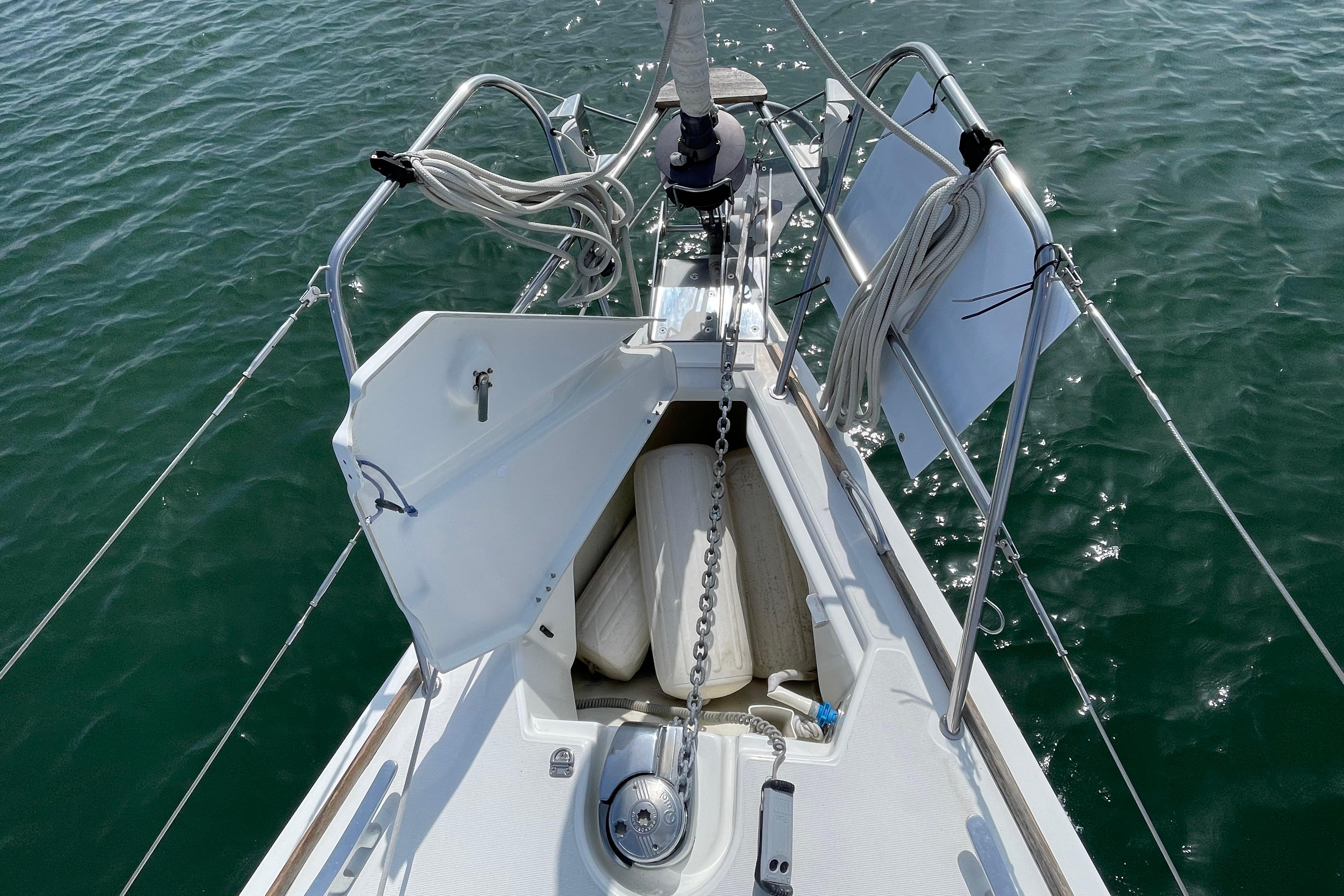 Bow view of 2007 Jeanneau Sun Odyssey 39 DS sailboat with anchor chain and ropes.