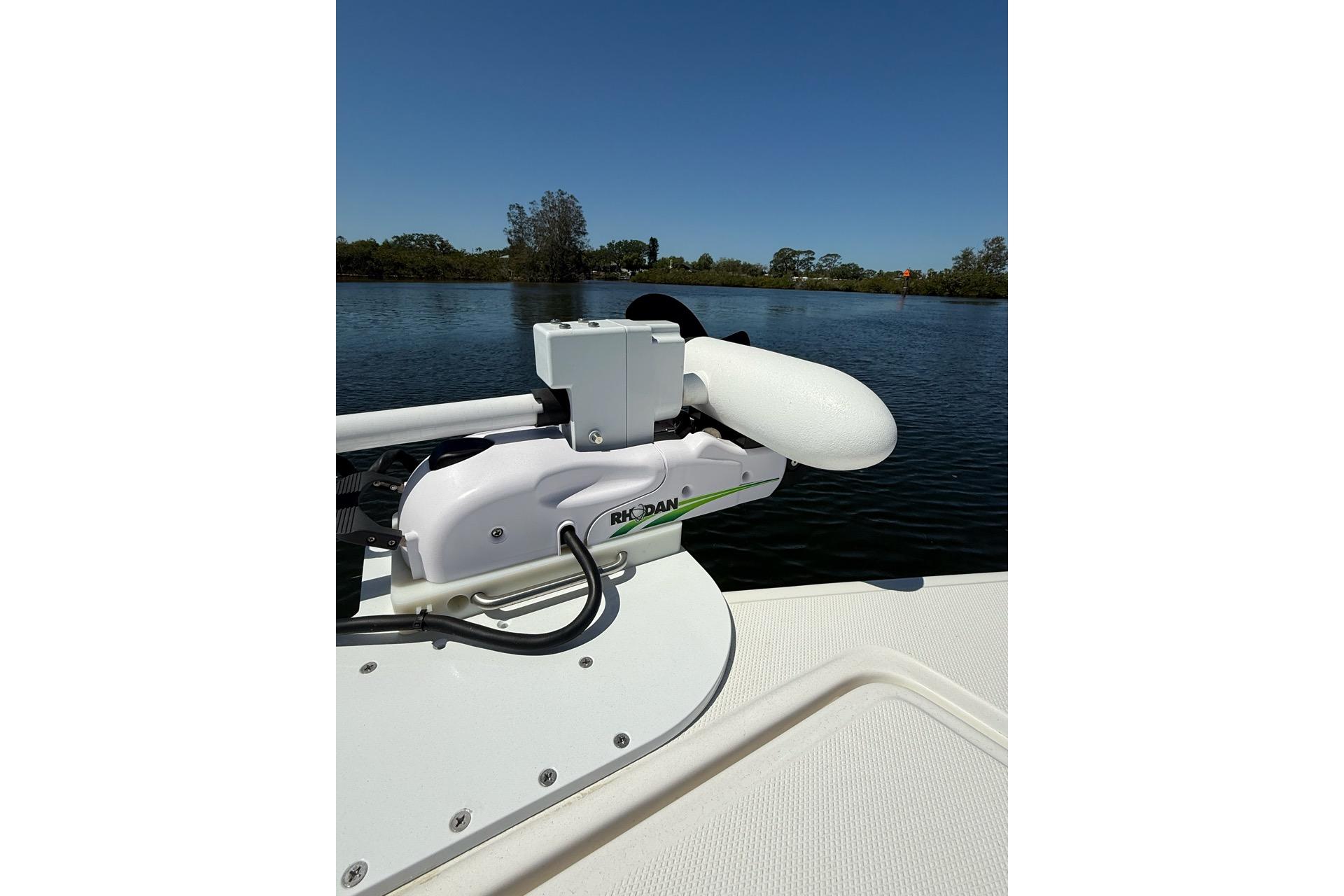 Custom Infusion 34 CC boat, 2021 model, with trolling motor on calm water.