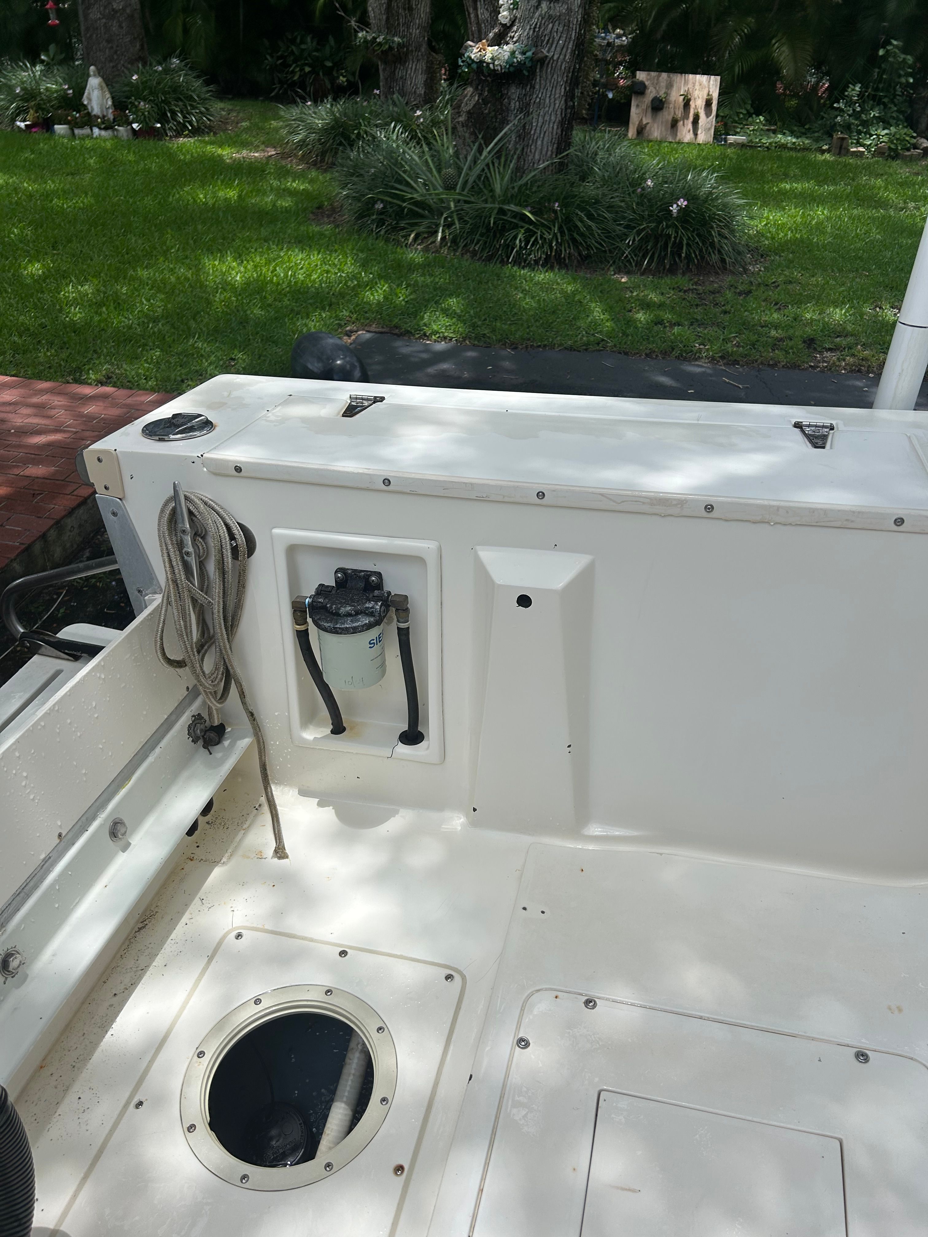 Interior of a 1992 Mako 221 boat with rope and filter.