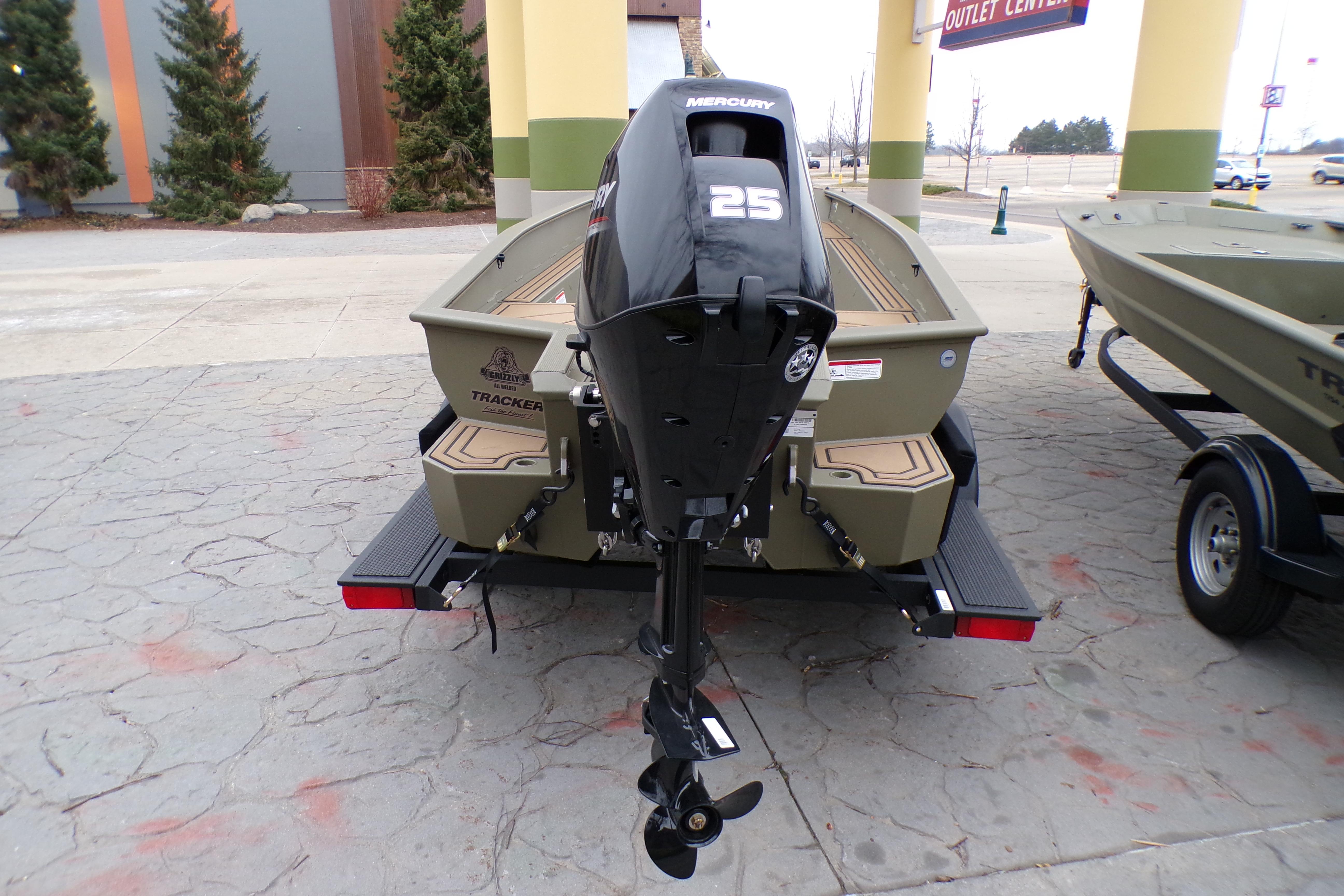 2026 Tracker Grizzly 1650 T Prairie Wings Edition boat with Mercury 25 outboard motor.