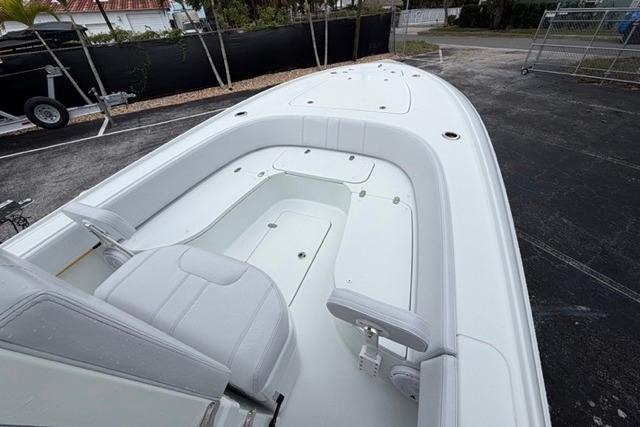 2025 Contender 26 Bay boat interior with white seating and spacious deck.