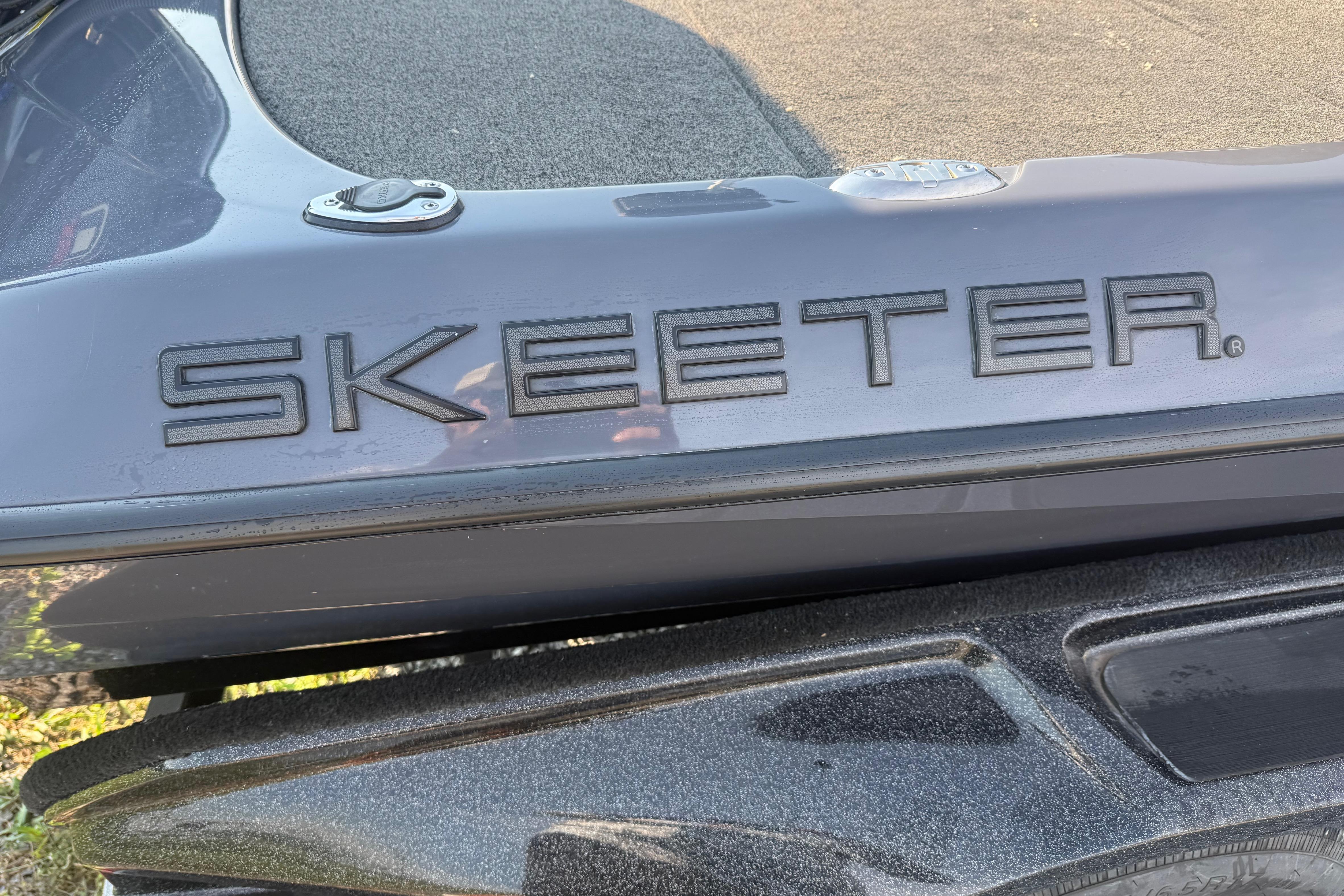 2024 Skeeter FXR21 boat with sleek design and prominent logo.