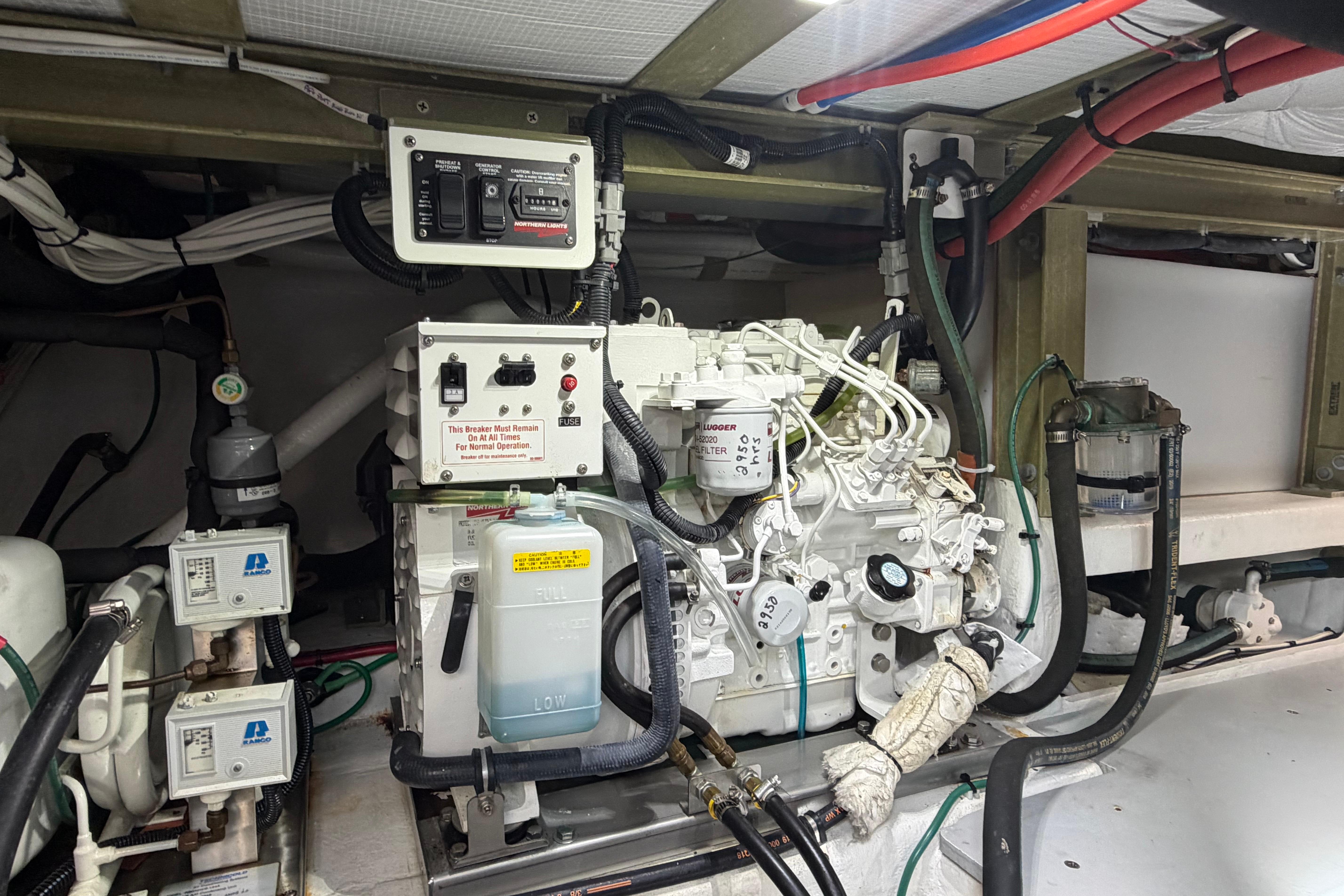 Engine room of 2018 H&H Marine Osmond Beal boat, featuring mechanical components and wiring.