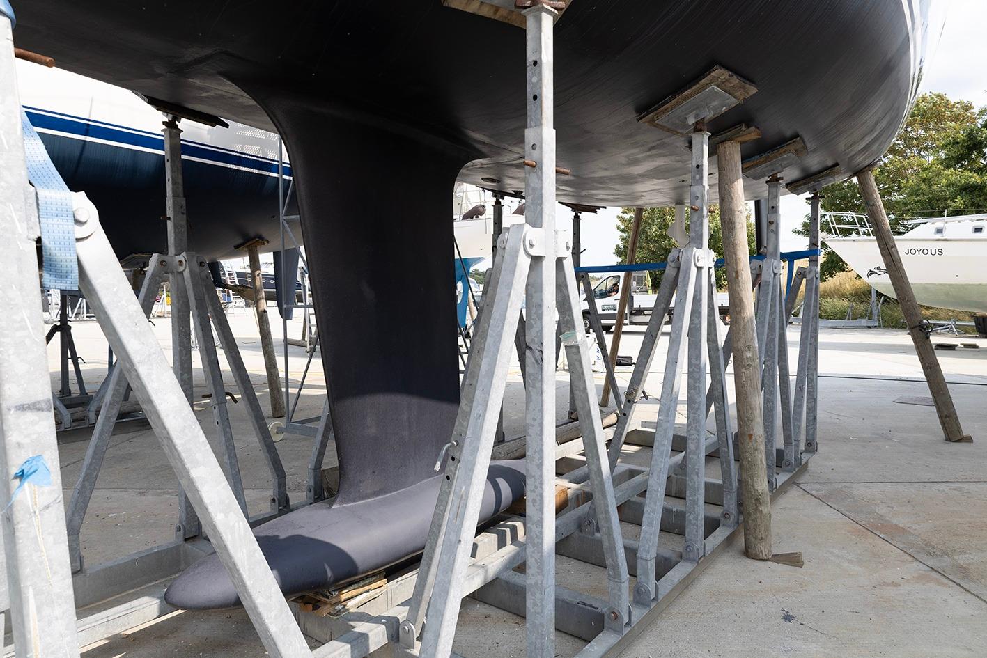 Grand Soleil 46 yacht keel on stands, 2010 model, in a boatyard setting.