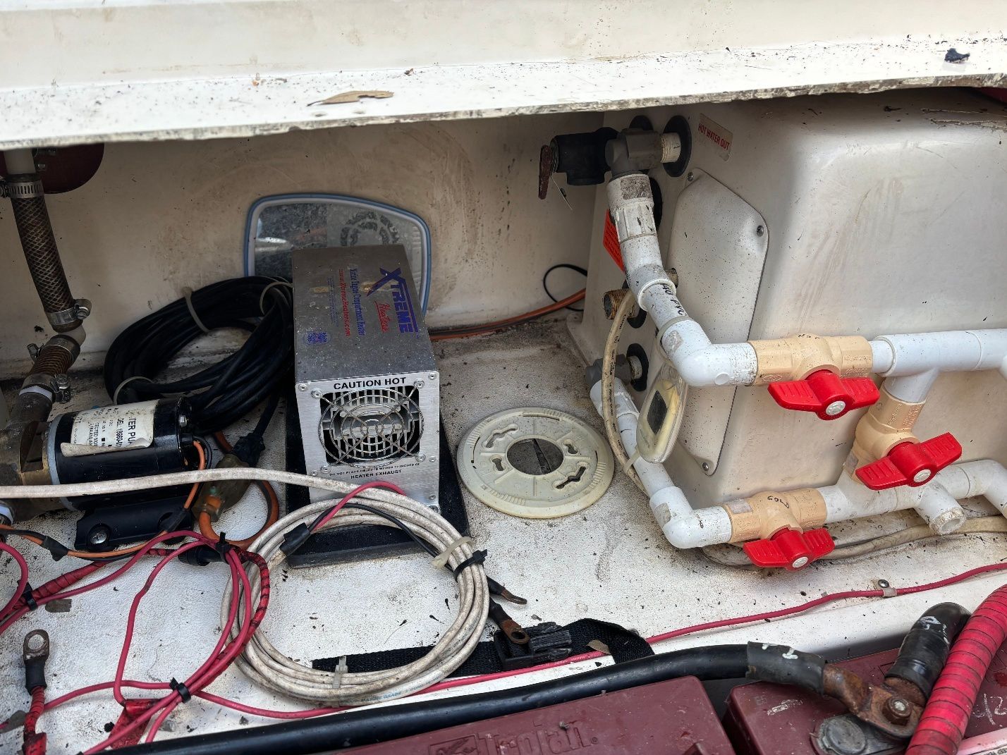 Interior of a 1997 Donzi 275LXC boat with wiring and plumbing.