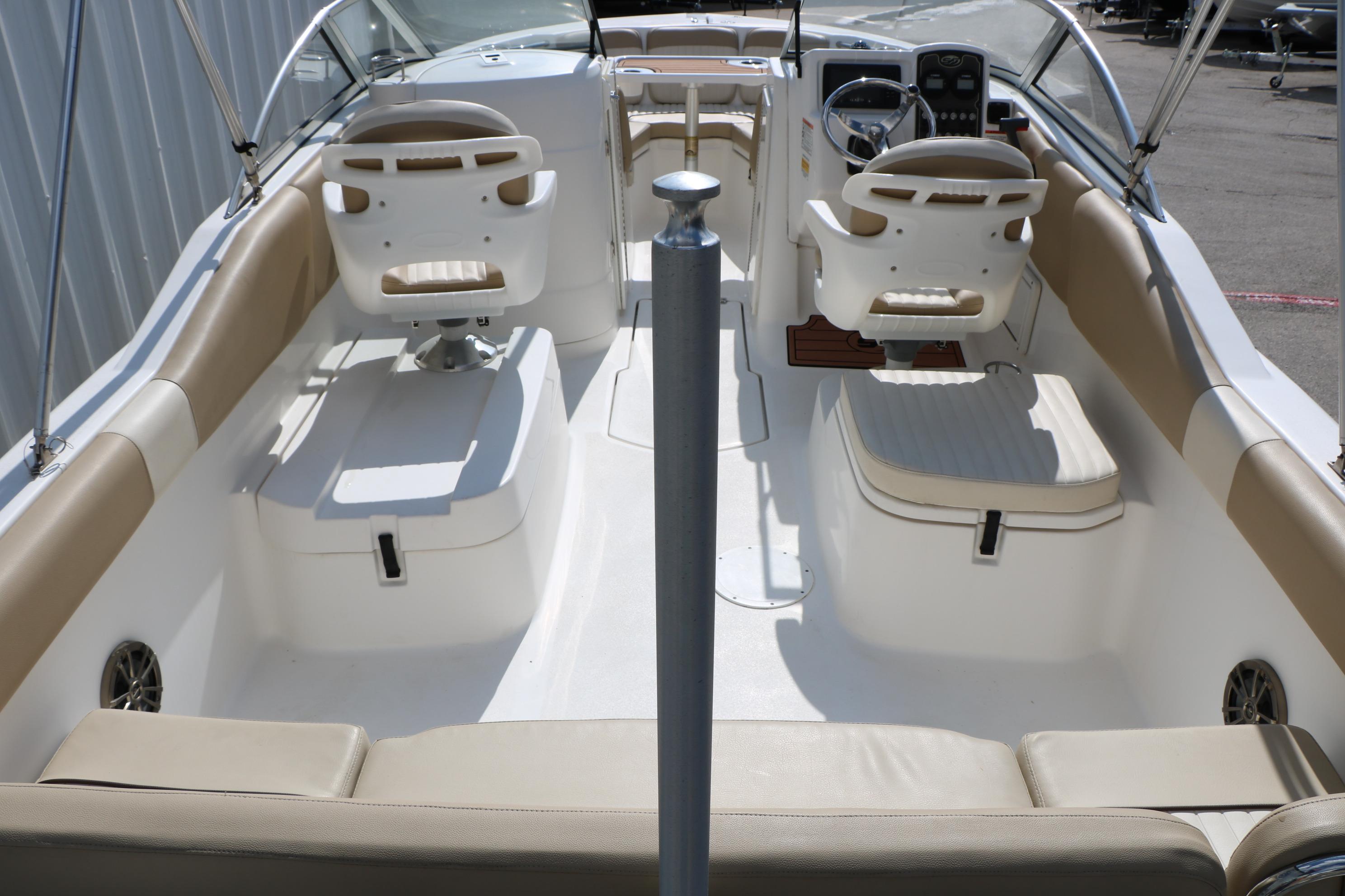 2017 Sea Fox 226 Traveler boat interior with seating and steering console.