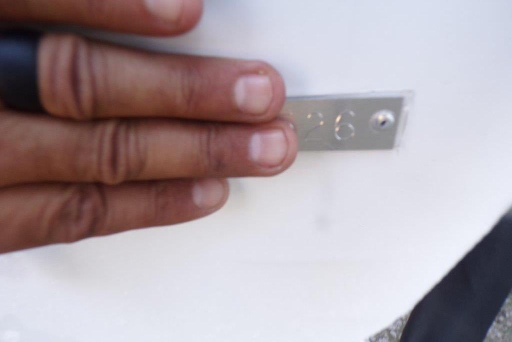 Hand touching metal plate on 2026 Xpress H20B Bay boat.