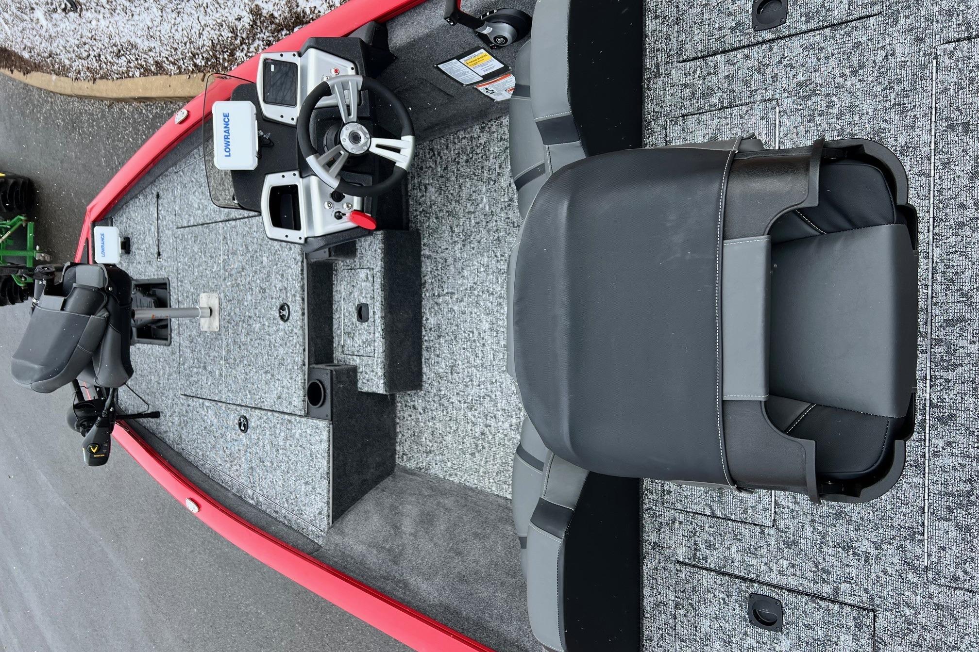 2026 Tracker Pro Team 175 boat interior with steering wheel and seating.