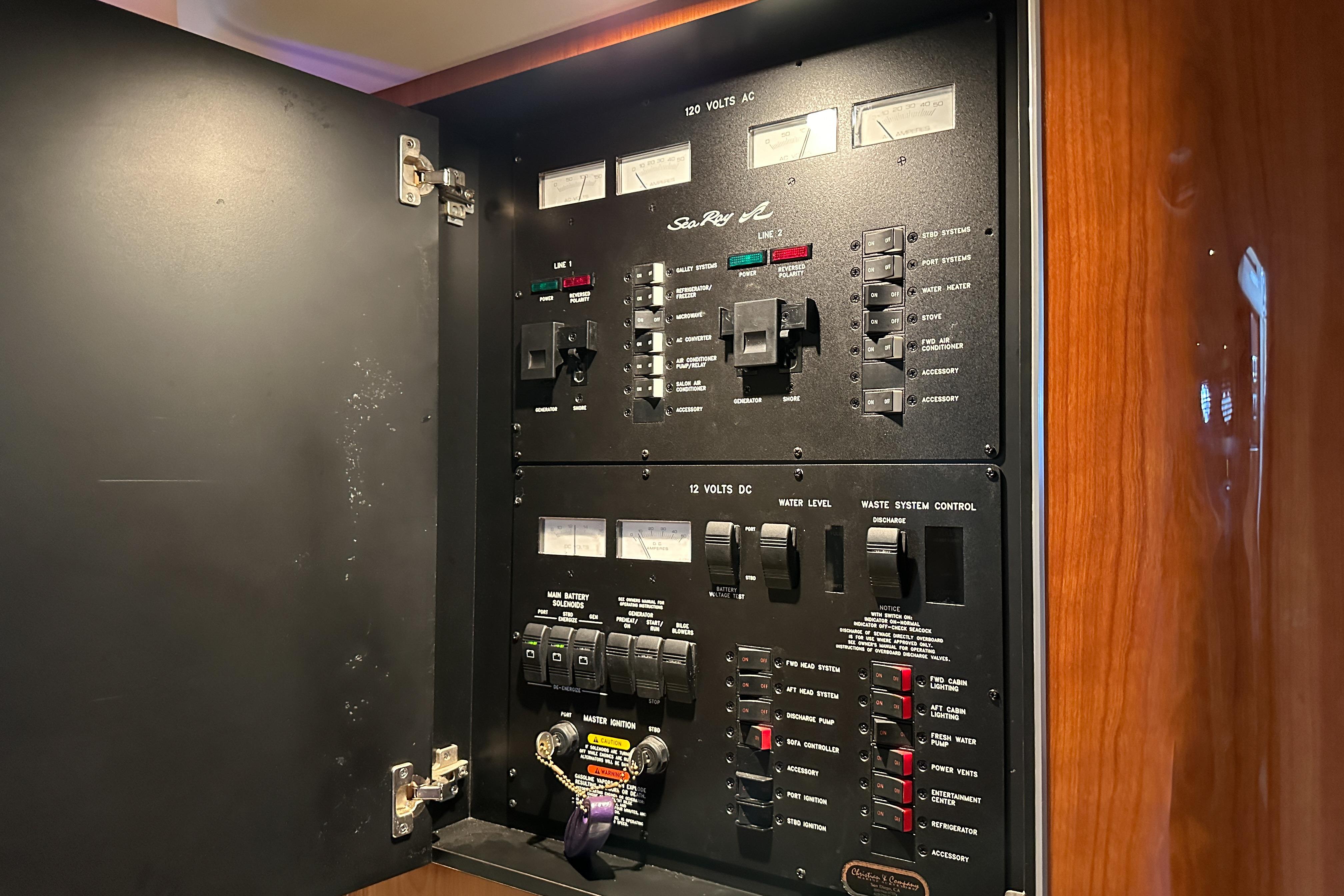 Electrical control panel inside a 2001 Sea Ray 410 Sundancer yacht.