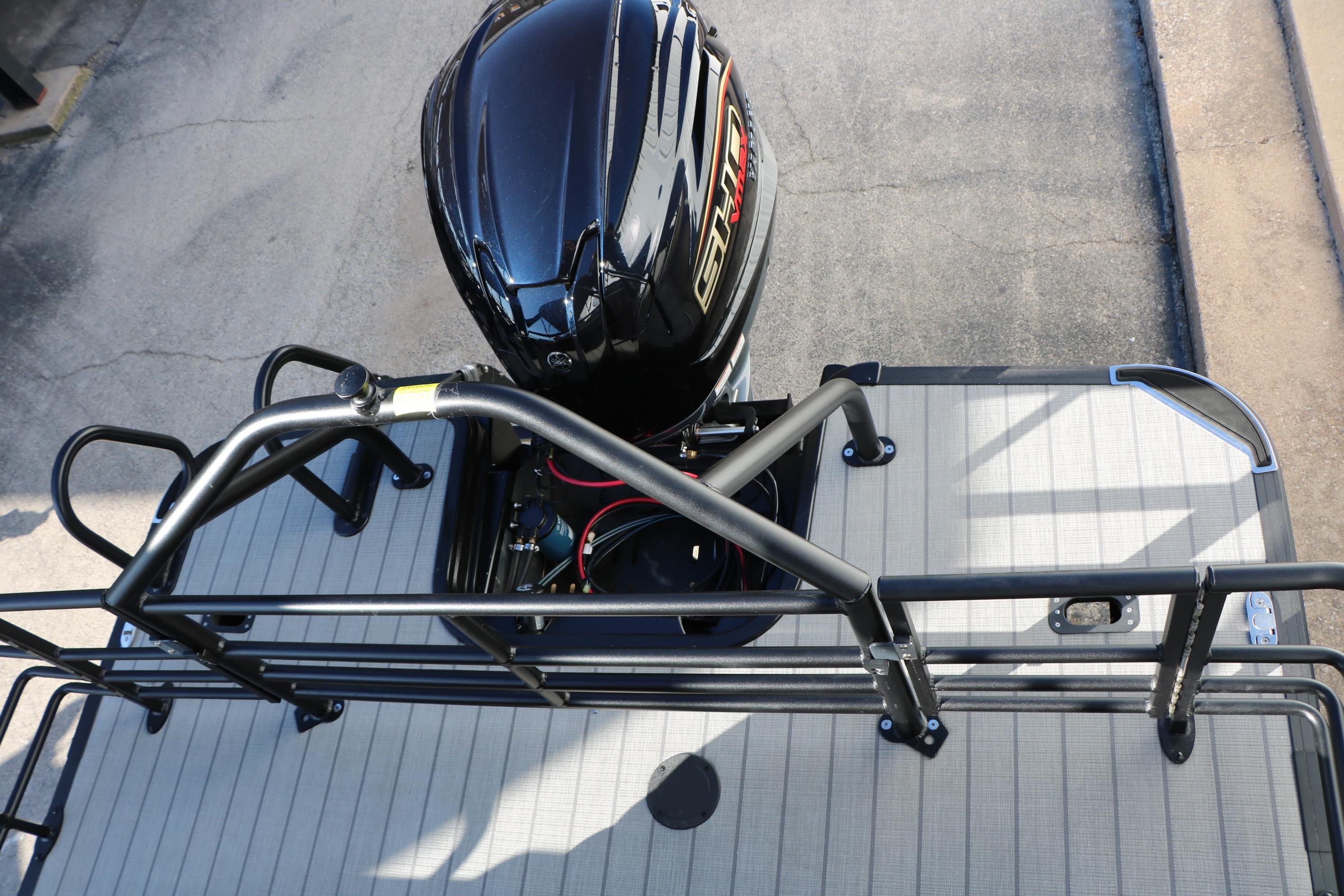 2026 Sylvan L3 CLZ DH boat with sleek black motor and sturdy railing.