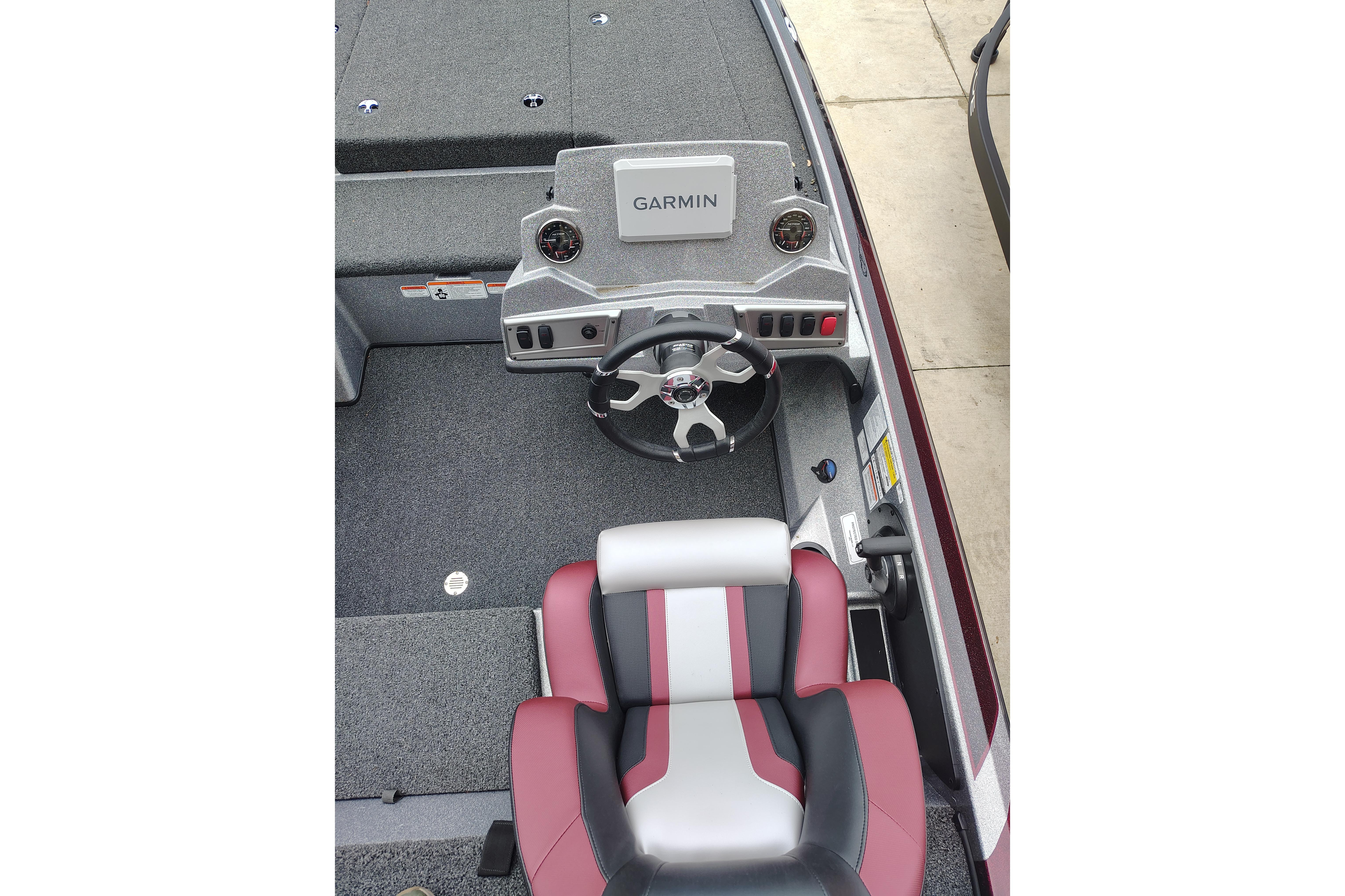 2026 Nitro Z18 Pro boat cockpit with Garmin navigation system and stylish seating.