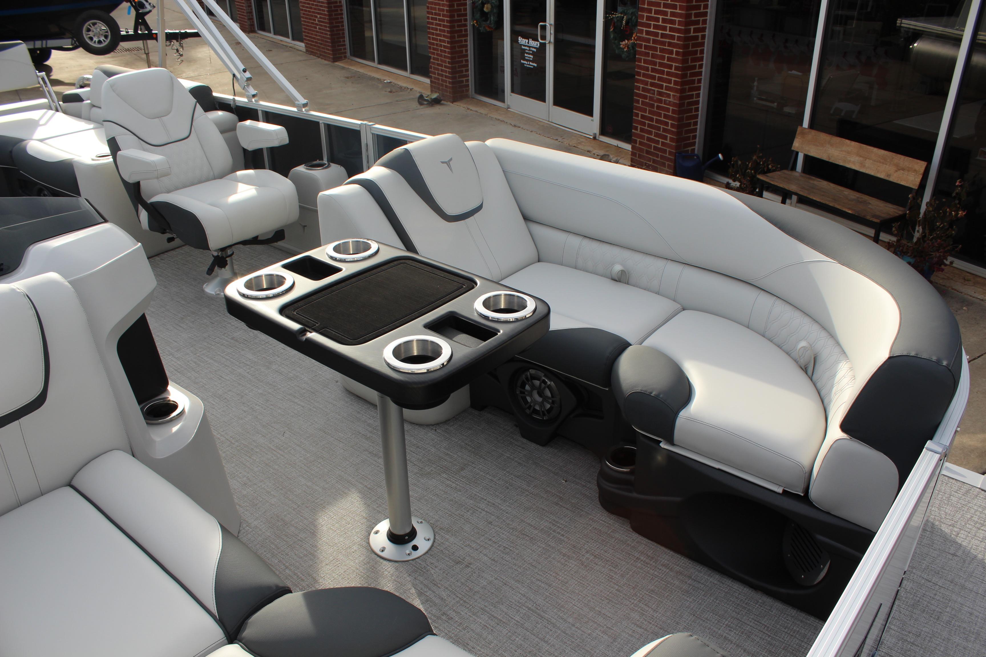 2026 Tahoe Pontoon LTZ interior with plush seating and cup holders.