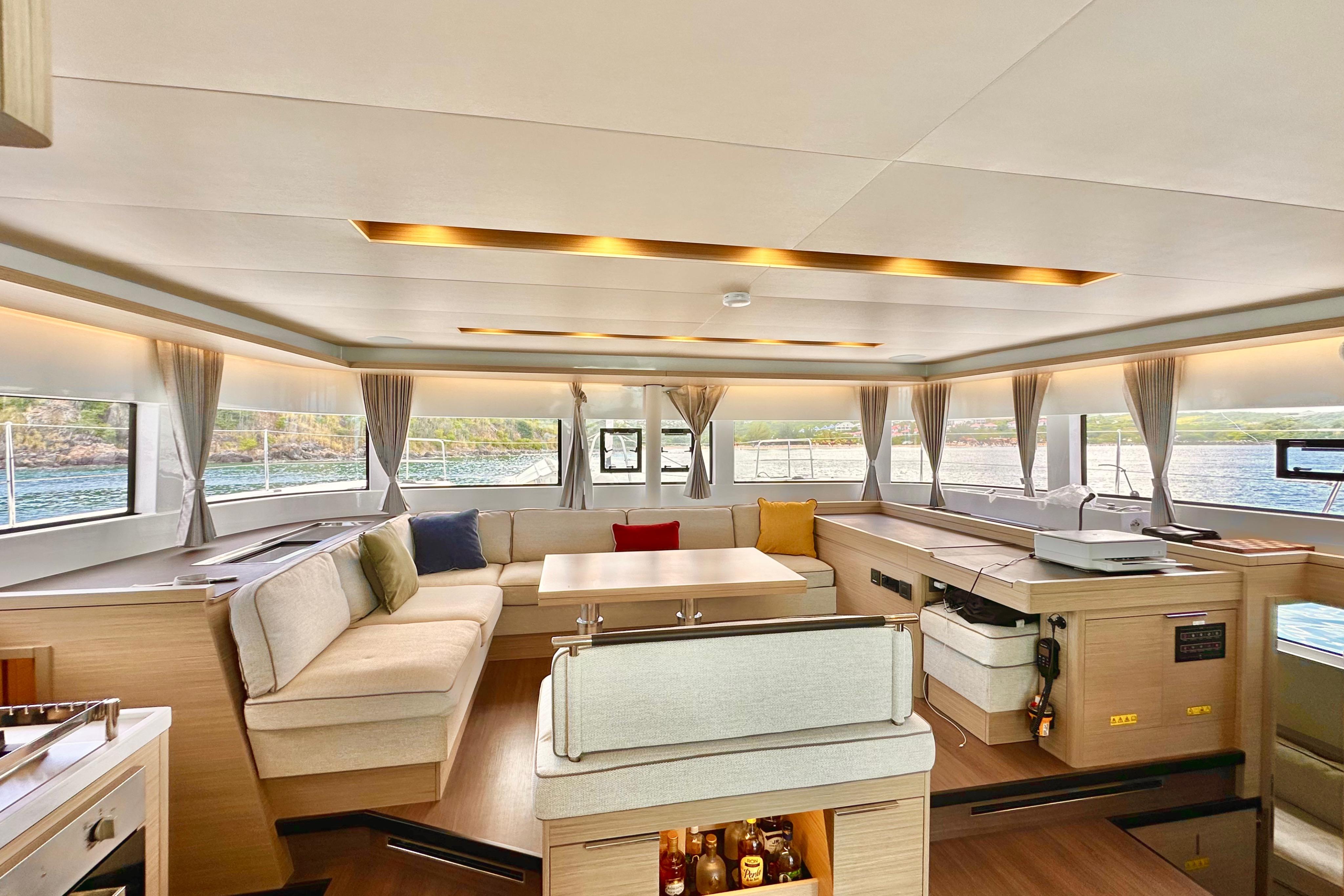 Luxurious interior of 2024 Lagoon 51 yacht with spacious seating and modern design.