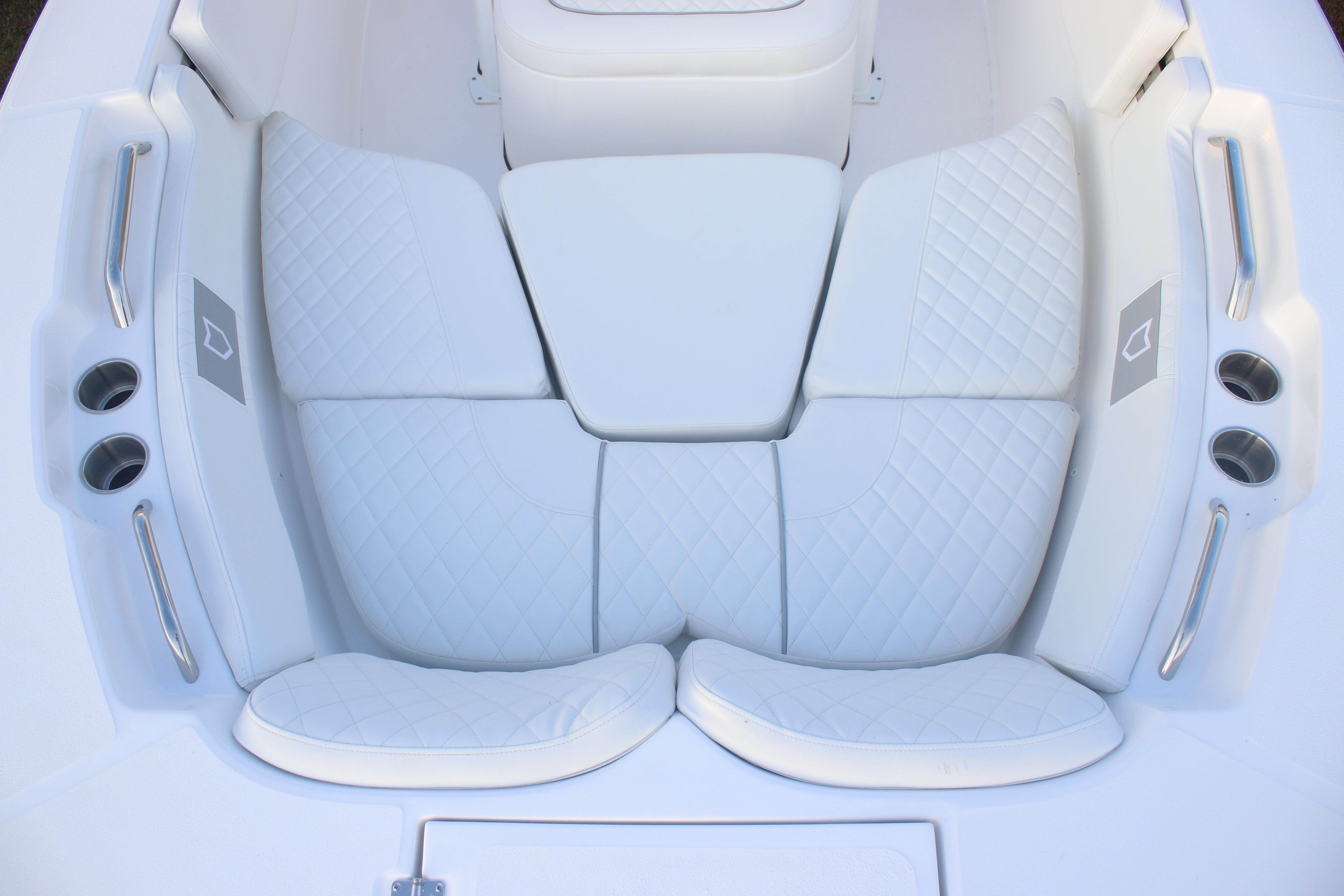 Luxurious seating on 2026 Sea Fox 228 Commander boat, featuring white quilted upholstery.
