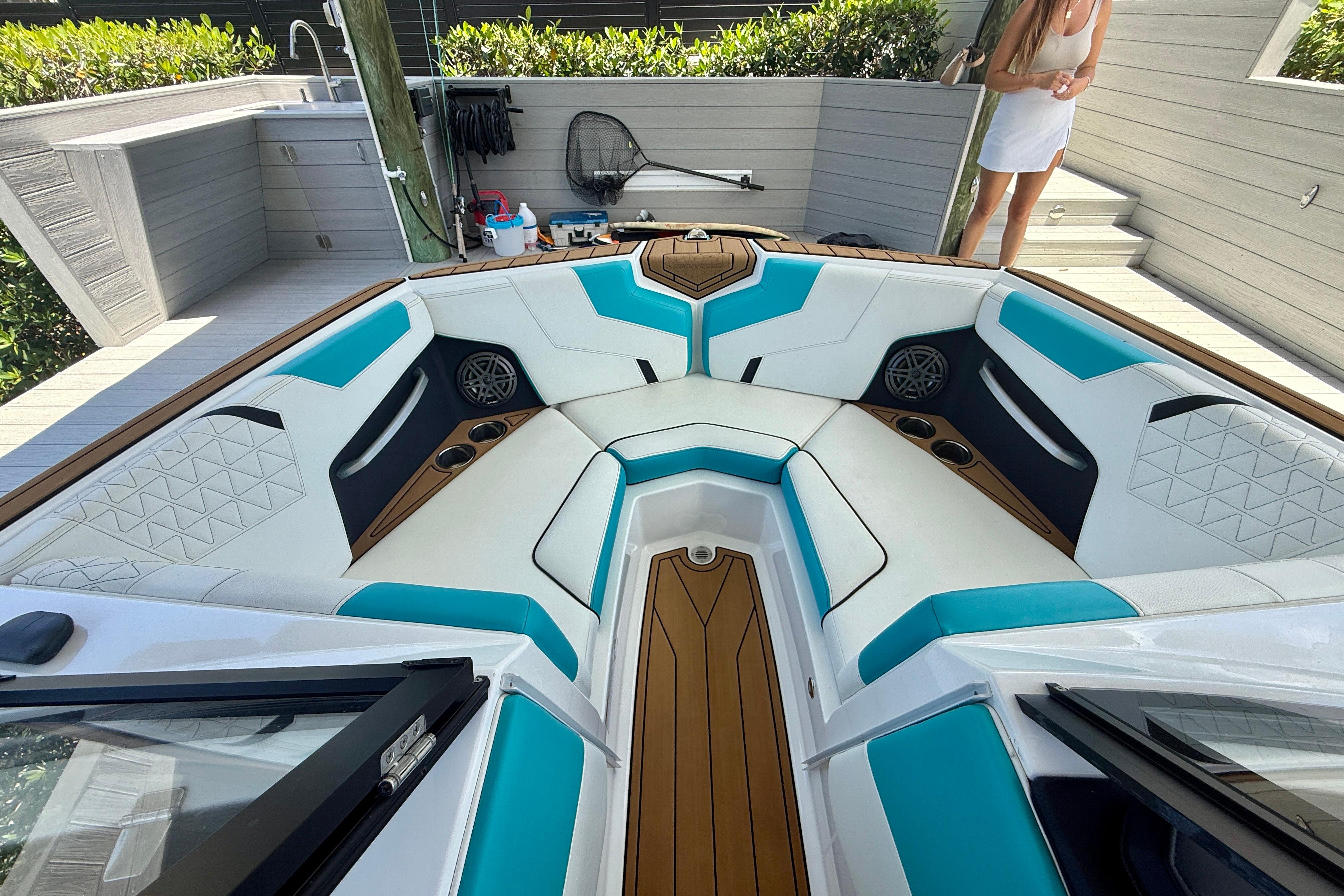 2024 Nautique Super Air Nautique GS20 boat interior with teal and white seating.