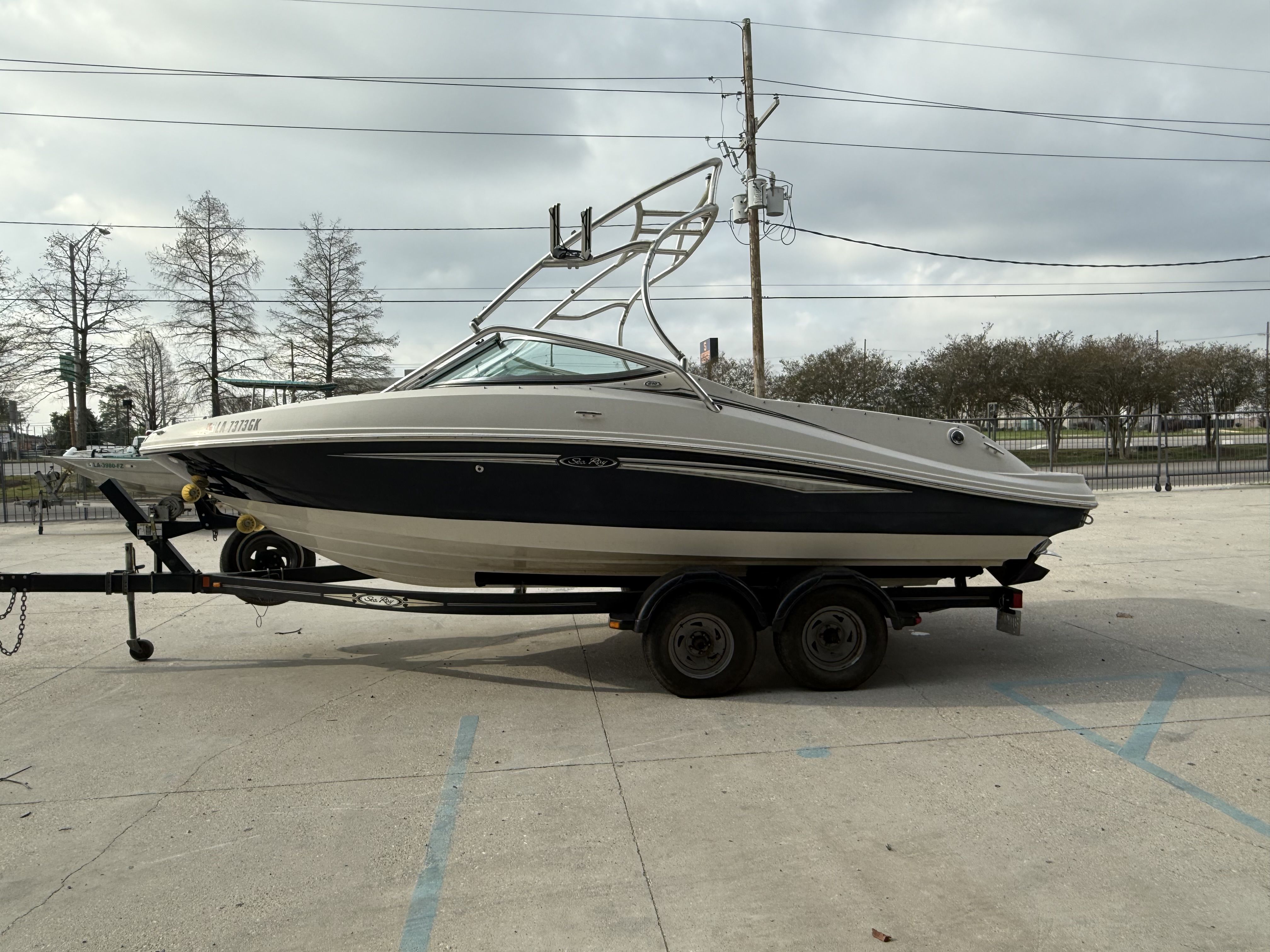 2007 Sea Ray 210 boat on trailer, side view.