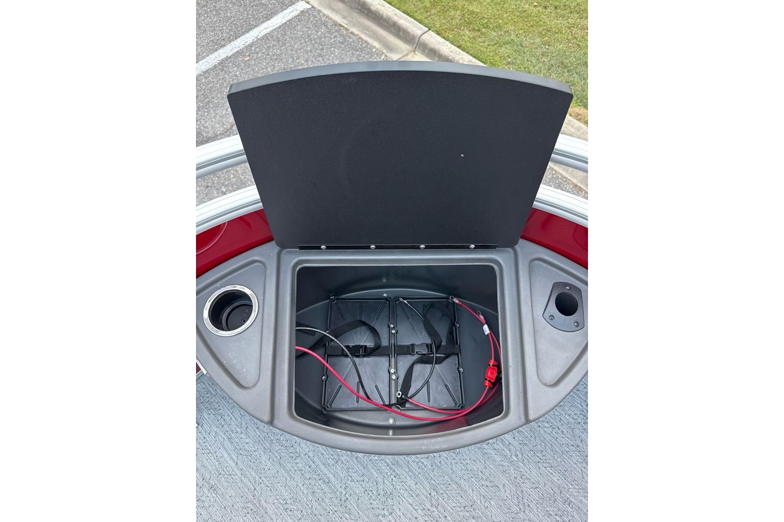 Open storage compartment on 2026 Sun Tracker Fishin' Barge 22 DLX boat.