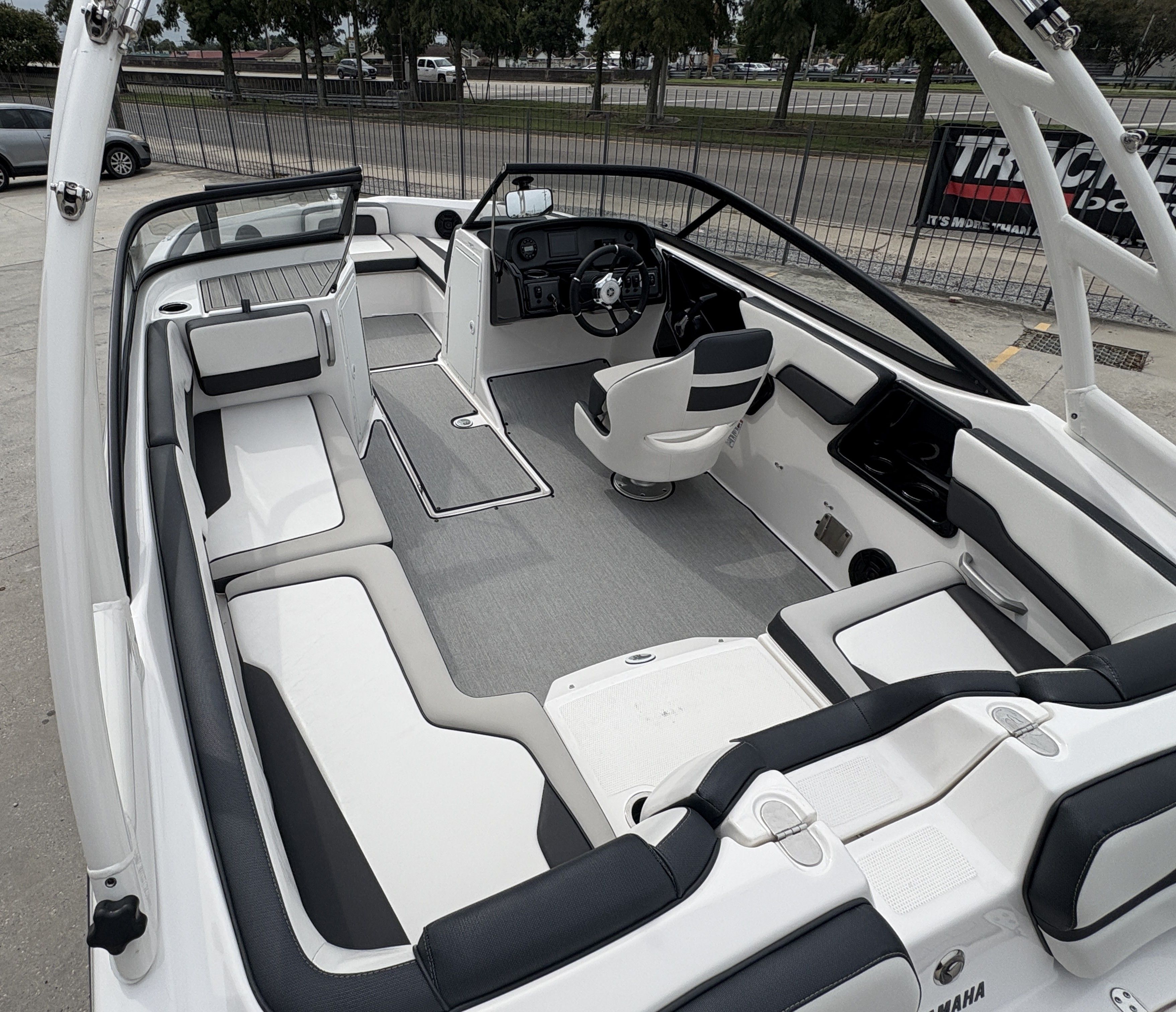 2024 Yamaha Boats AR 195 interior with sleek seating and modern dashboard.