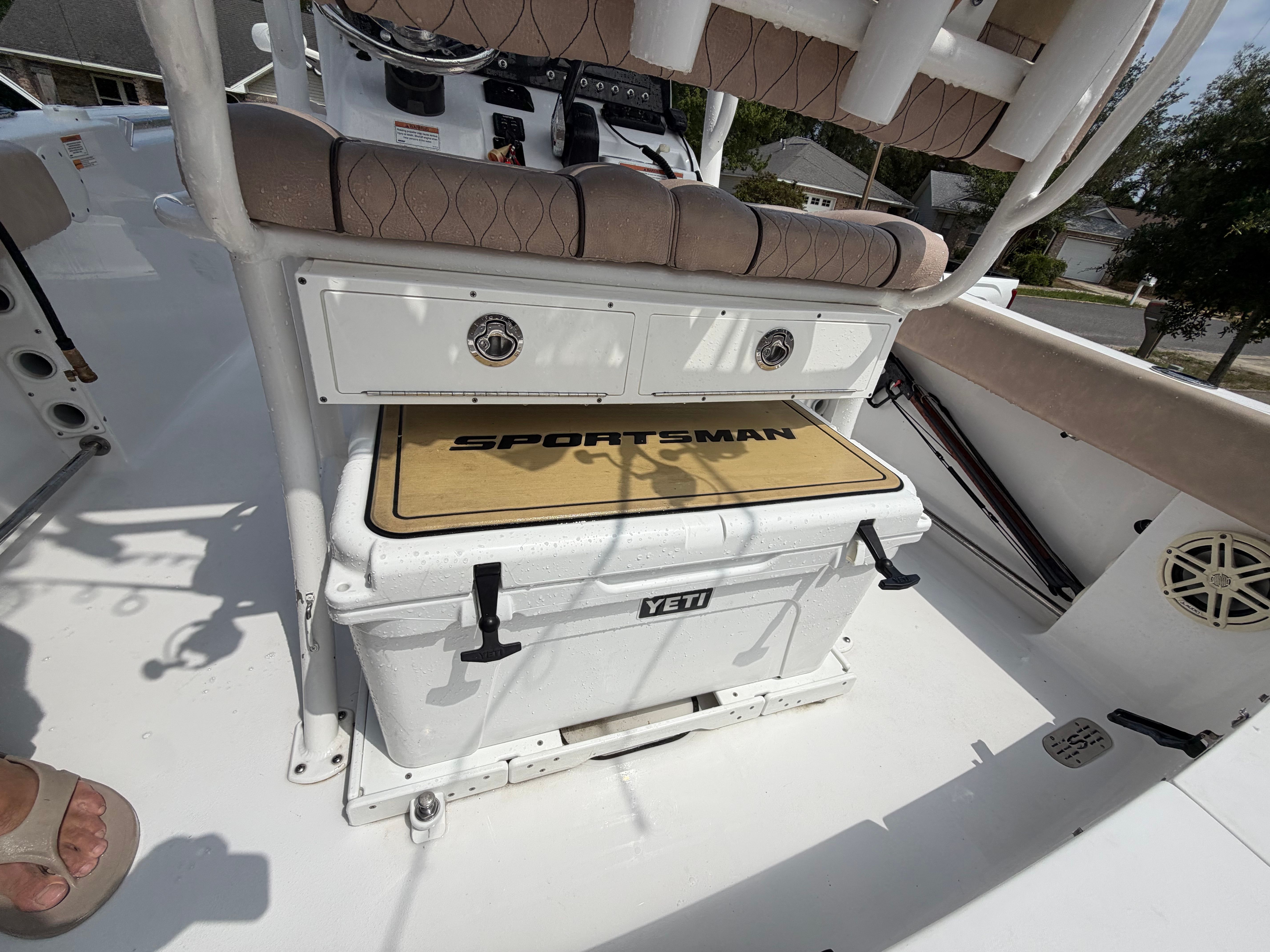 The image shows the cockpit of a 2020 Sportsman Heritage 211 Center Console boat with a Yeti cooler.