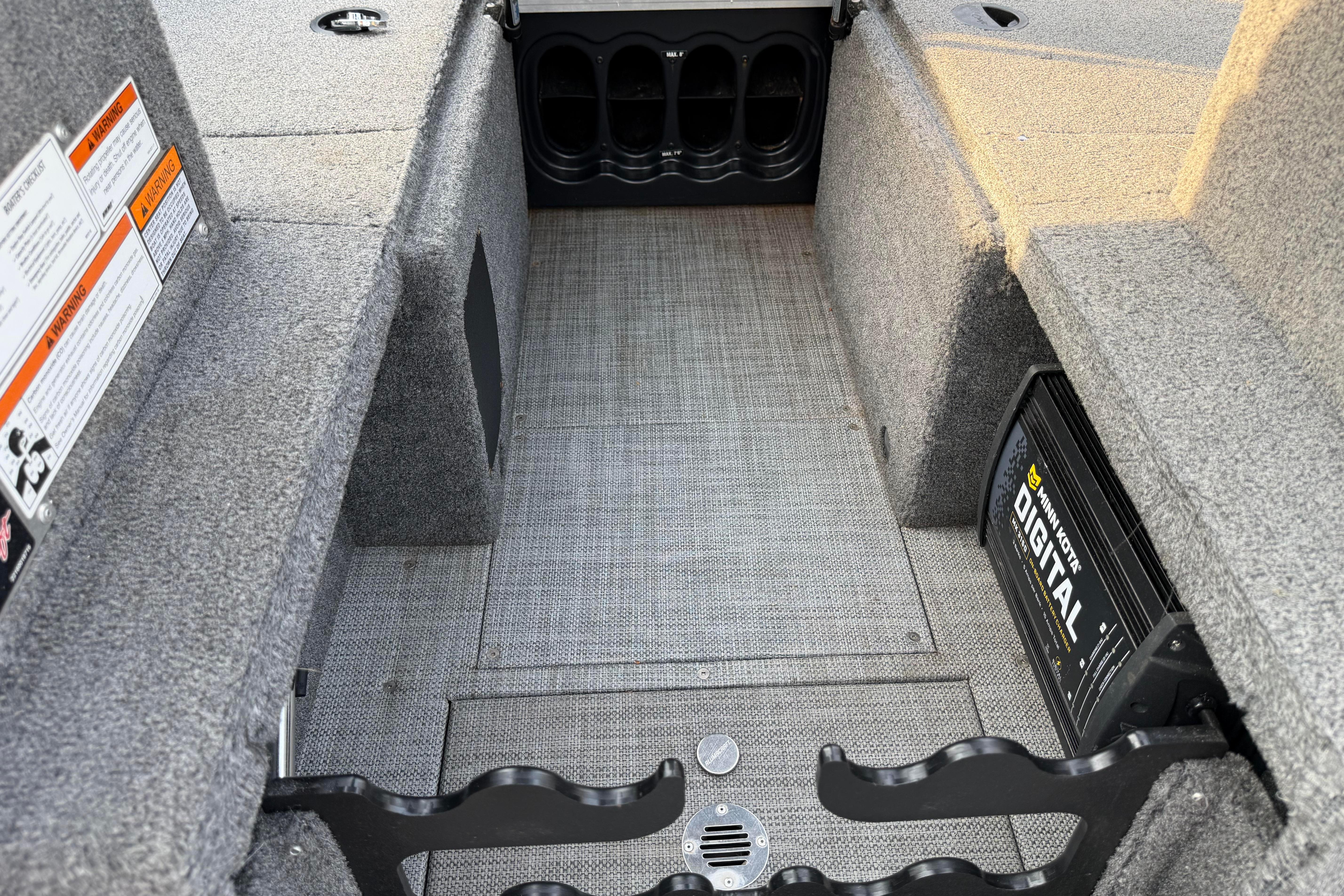 Interior of 2019 Alumacraft Trophy 205 boat with storage compartments and Minn Kota digital charger.