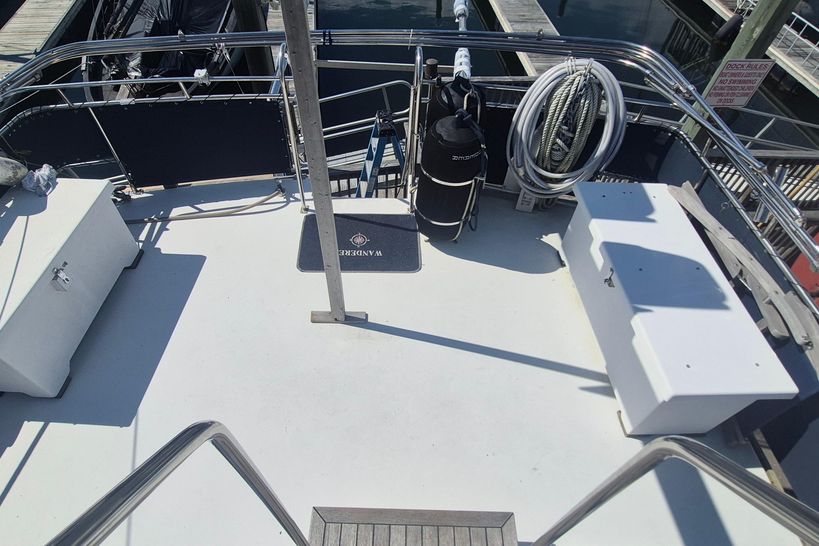 1983 Grand Banks 42 Motoryacht deck with storage boxes and coiled ropes.