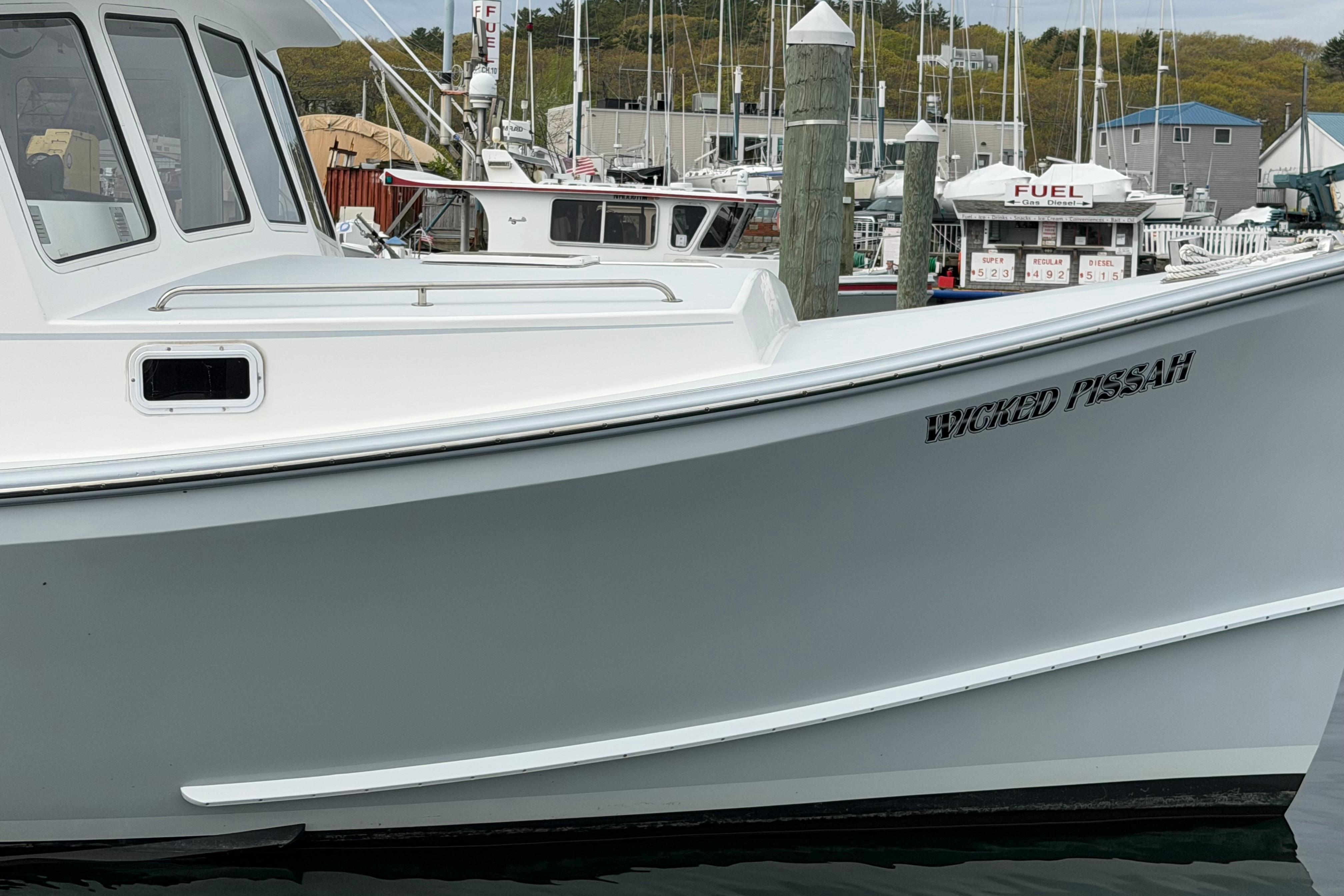 2018 H&H Marine Osmond Beal boat named "Wicked Pissah" docked at a marina.