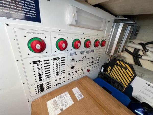 Control panel of a 2009 Ovation 52 boat with various switches and dials.