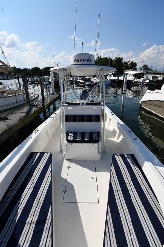 2021 Eastern 248 Center Console boat docked at a marina with Garmin equipment.