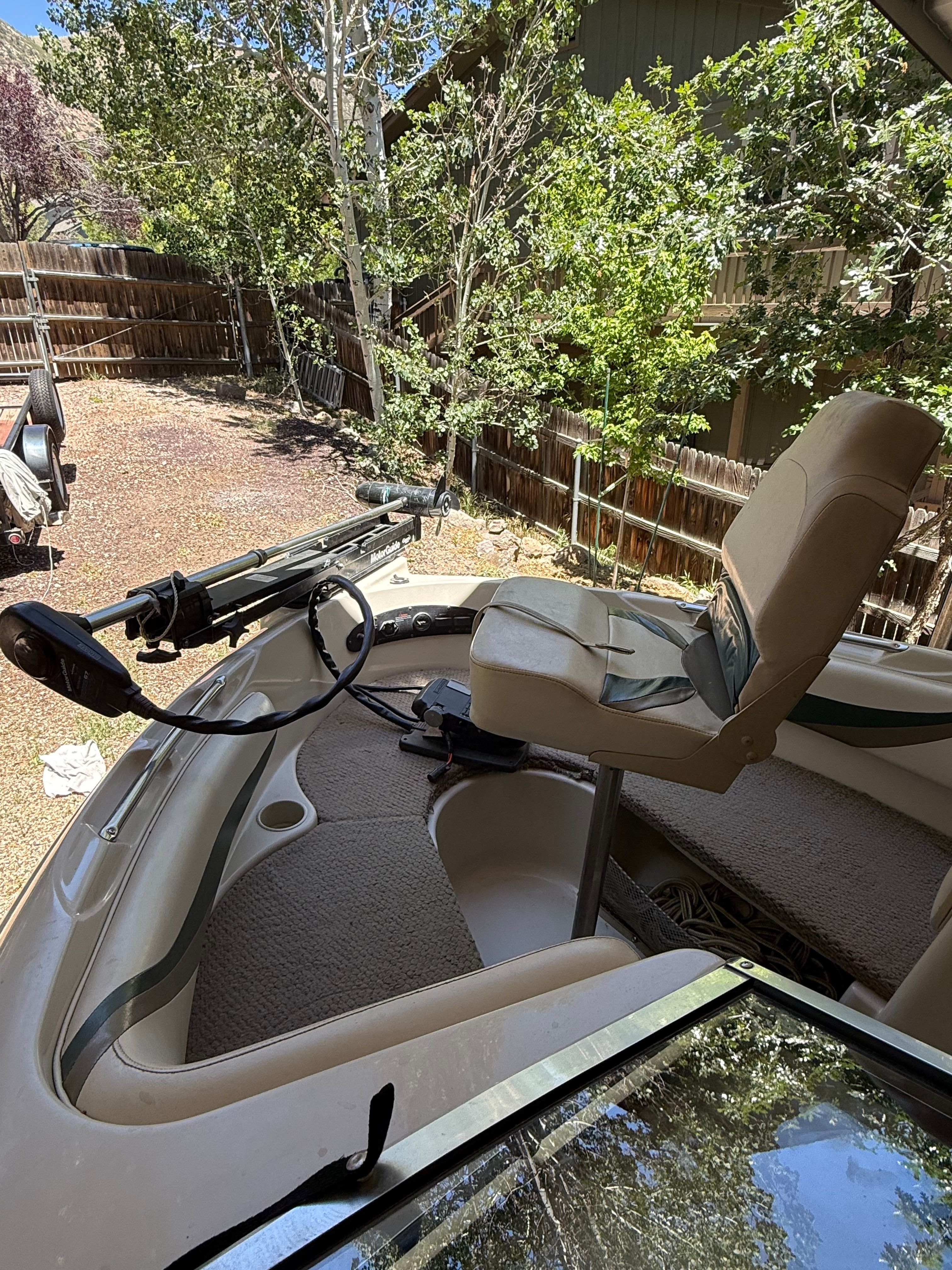 2002 Glastron GX 205 Ski & Fish boat with seat and controls.