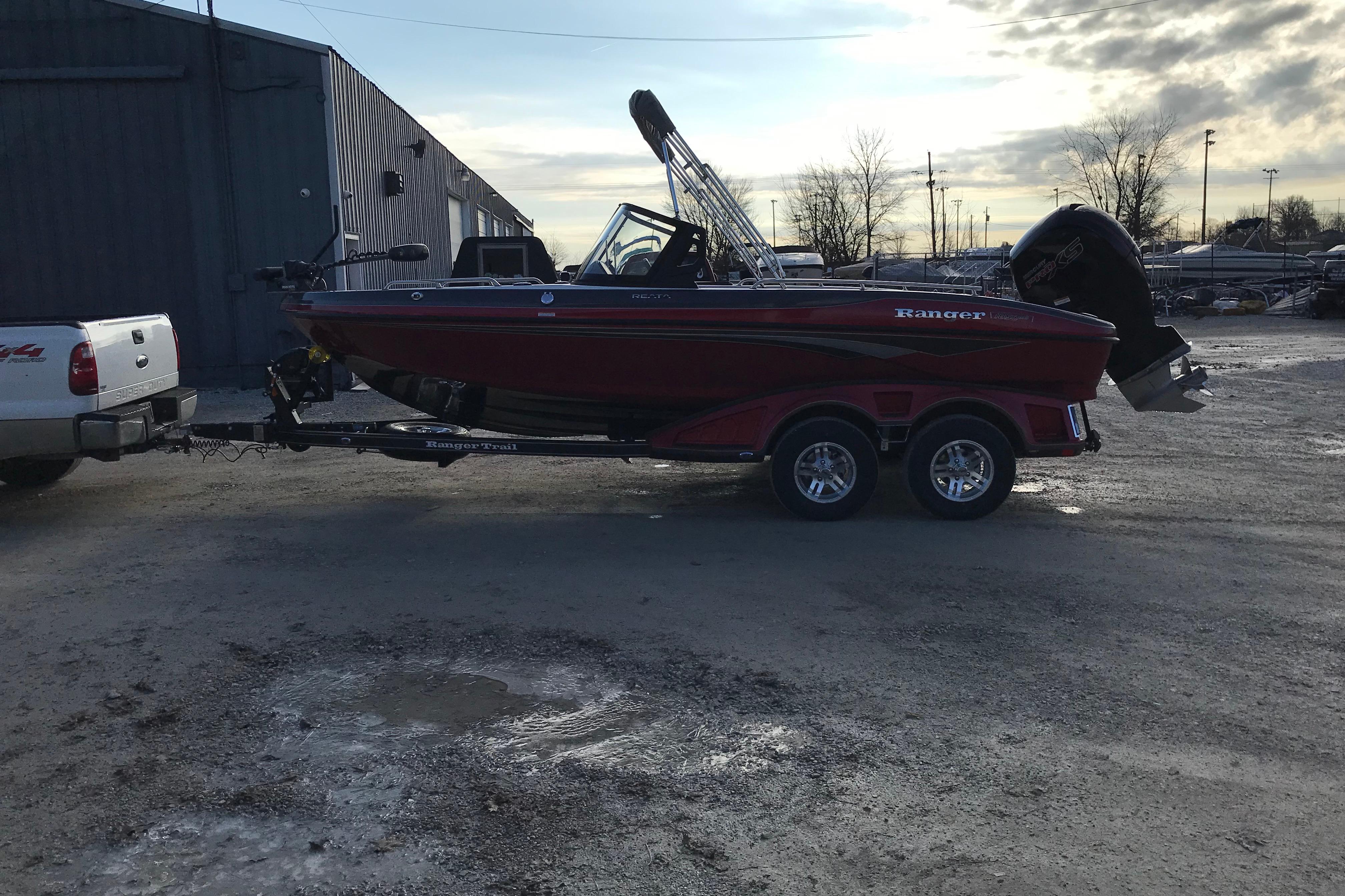 2026 Ranger 1850MS boat on trailer, parked outdoors near a building.
