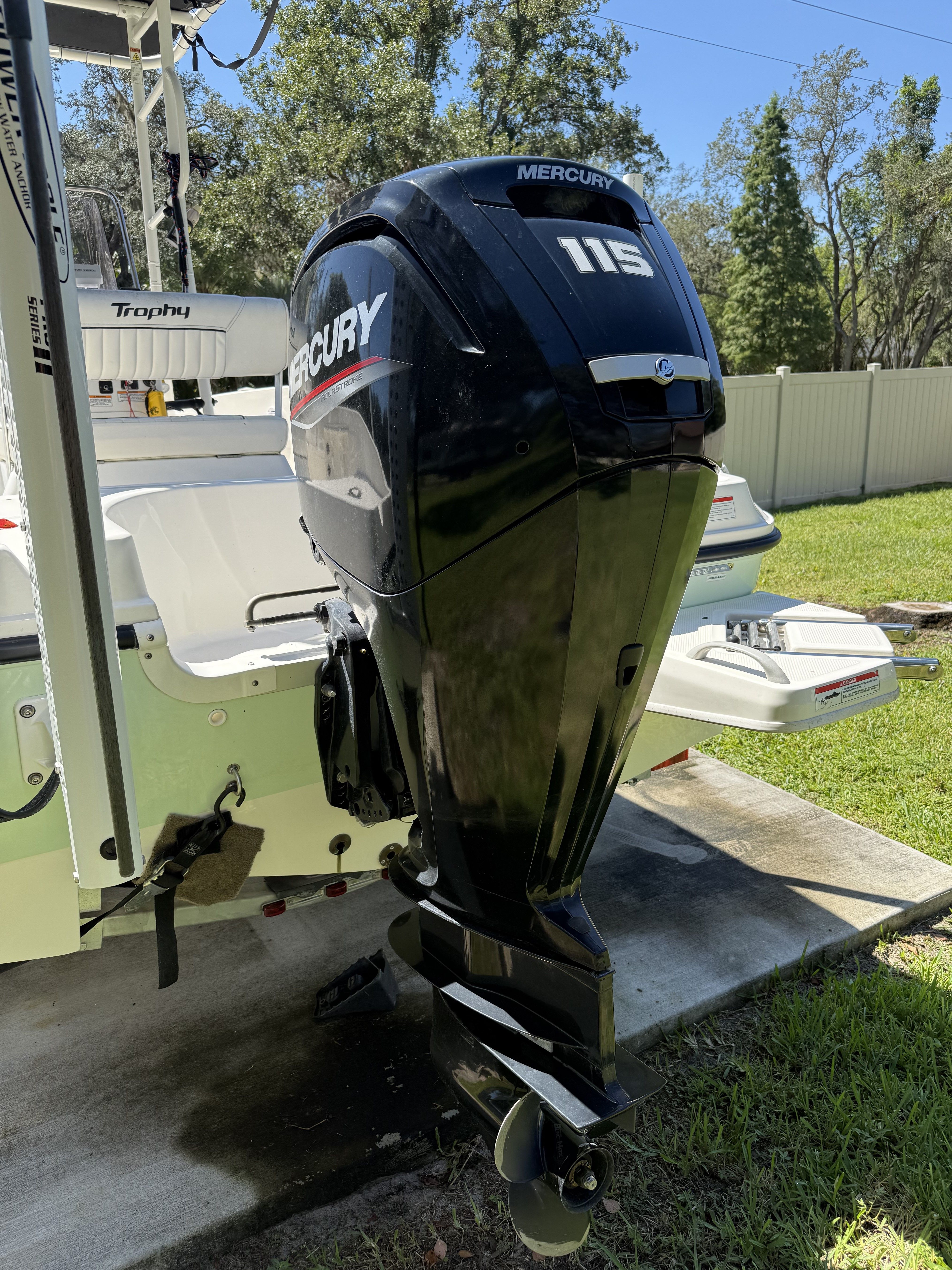 2022 Bayliner Trophy T18Bay with Mercury 115 outboard motor, parked on grass.