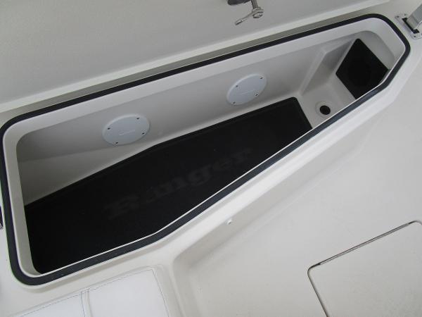 2024 Ranger 2360 Bay boat storage compartment with black mat and drainage hole.