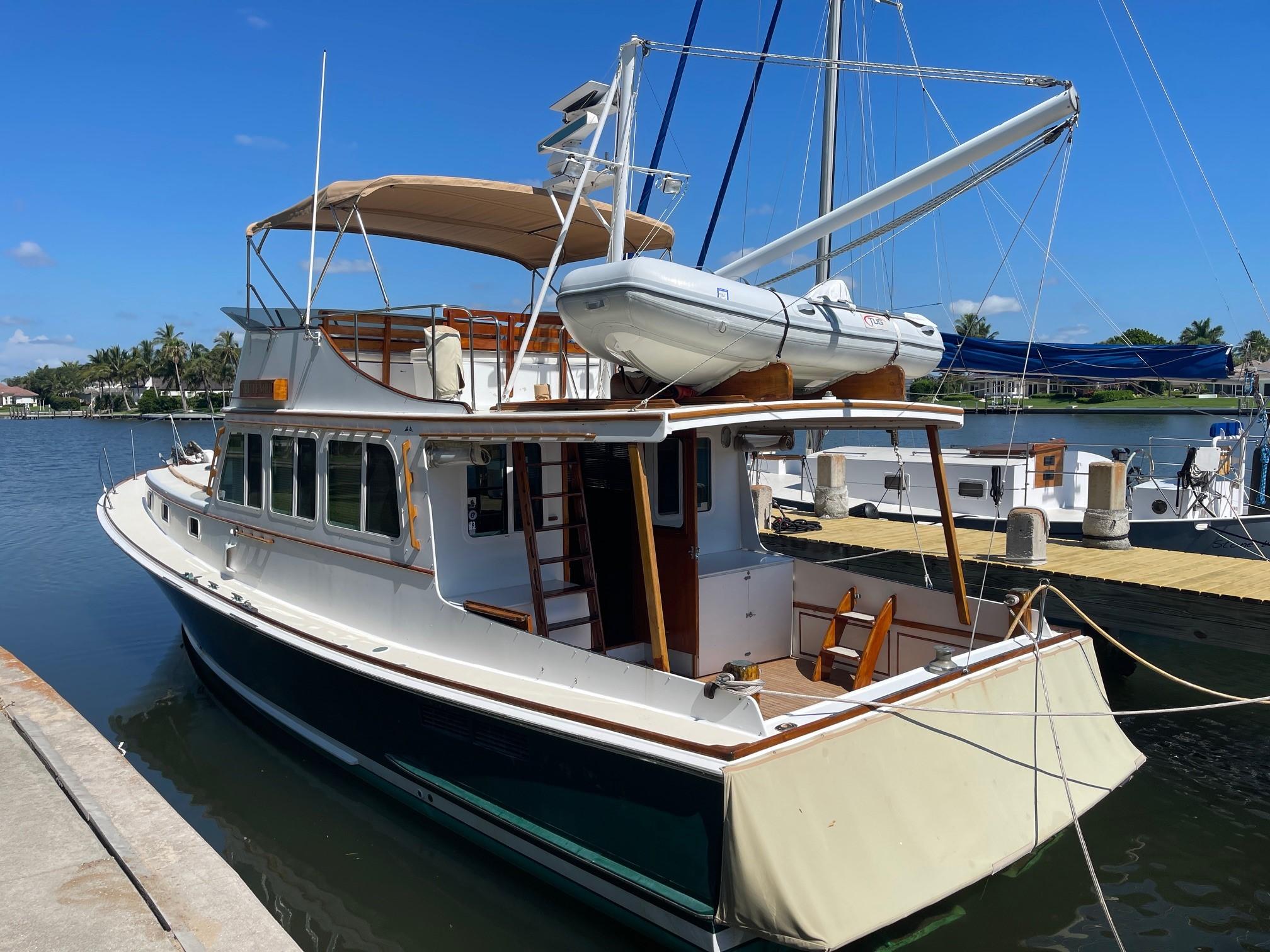 1979 Jarvis Newman Trawler docked at a marina on a sunny day.