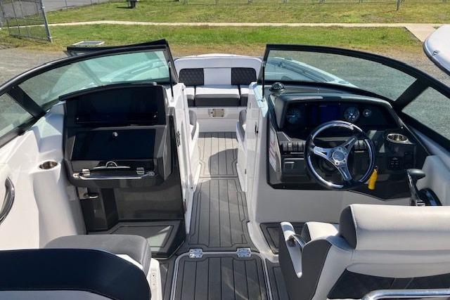 2024 Monterey M-65 boat interior with modern dashboard and seating.
