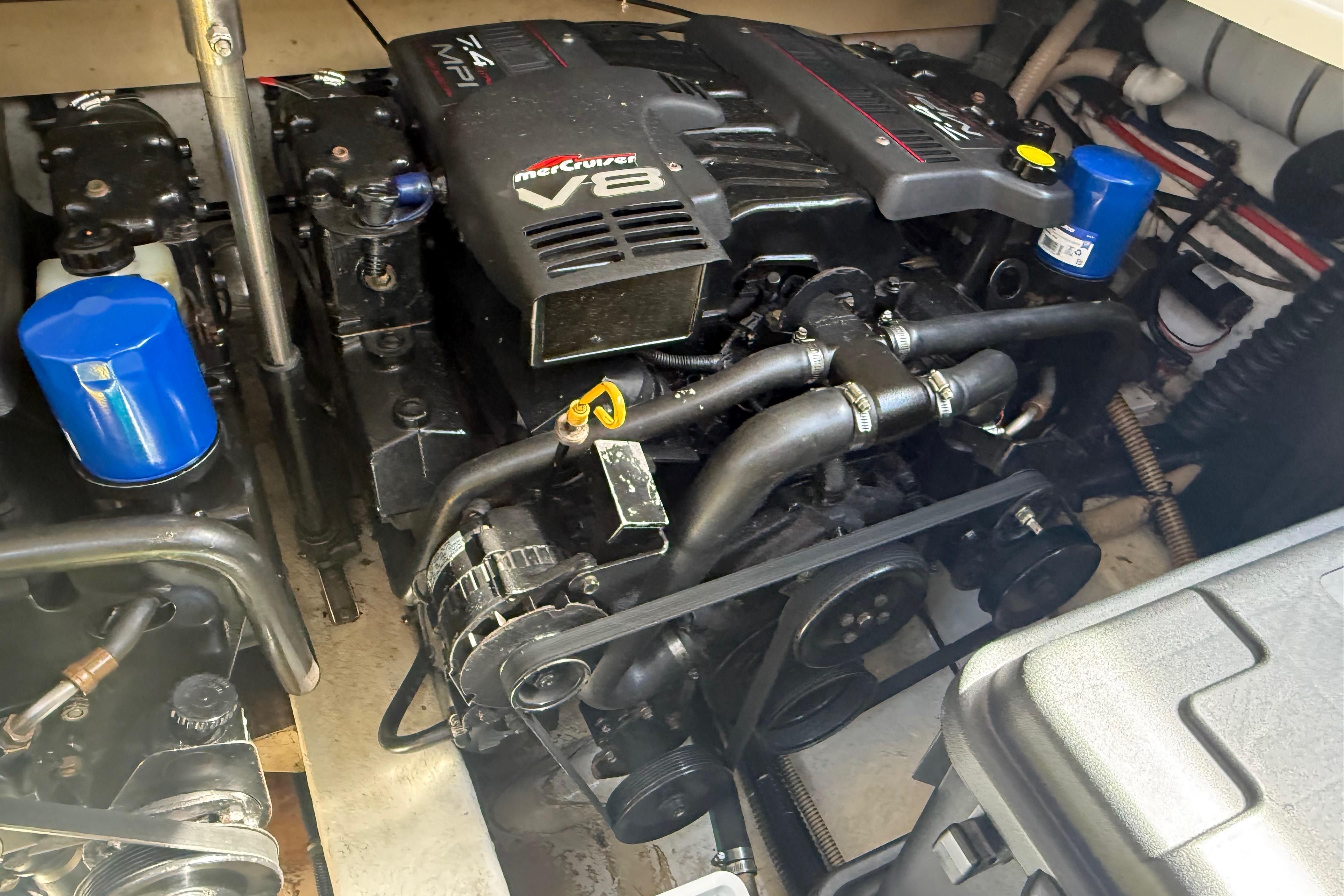 Engine compartment of a 1999 Formula 34 Performance Cruiser with MerCruiser V8 engine.