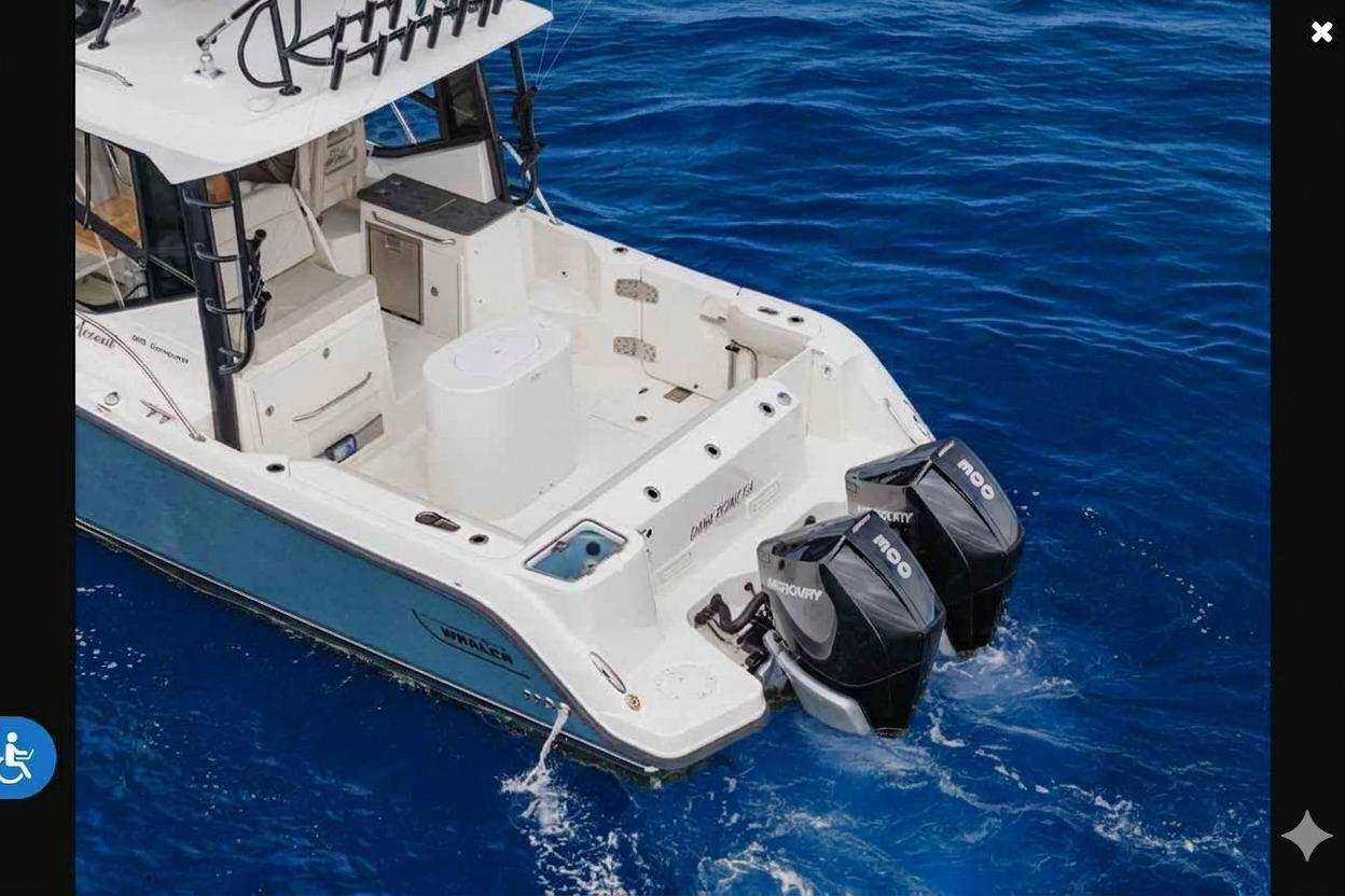 2022 Boston Whaler 325 Conquest boat with dual Mercury engines on blue ocean water.