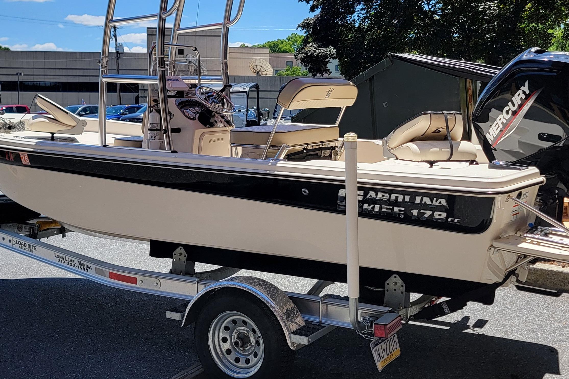 2021 Carolina Skiff 178 JLS boat on trailer, featuring a Mercury engine.