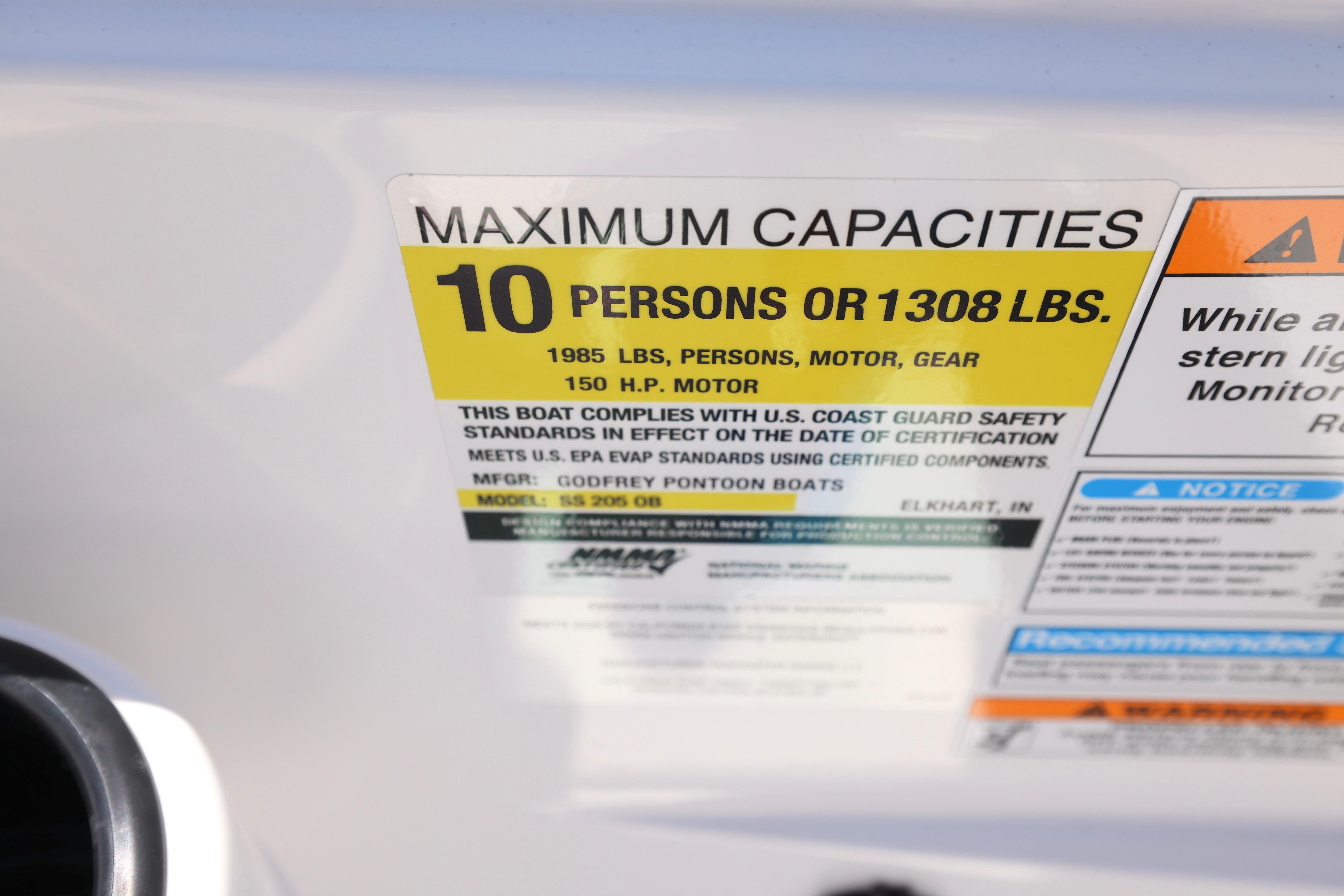 2026 Hurricane SunDeck Sport 205 OB capacity label, max 10 persons or 1308 lbs.