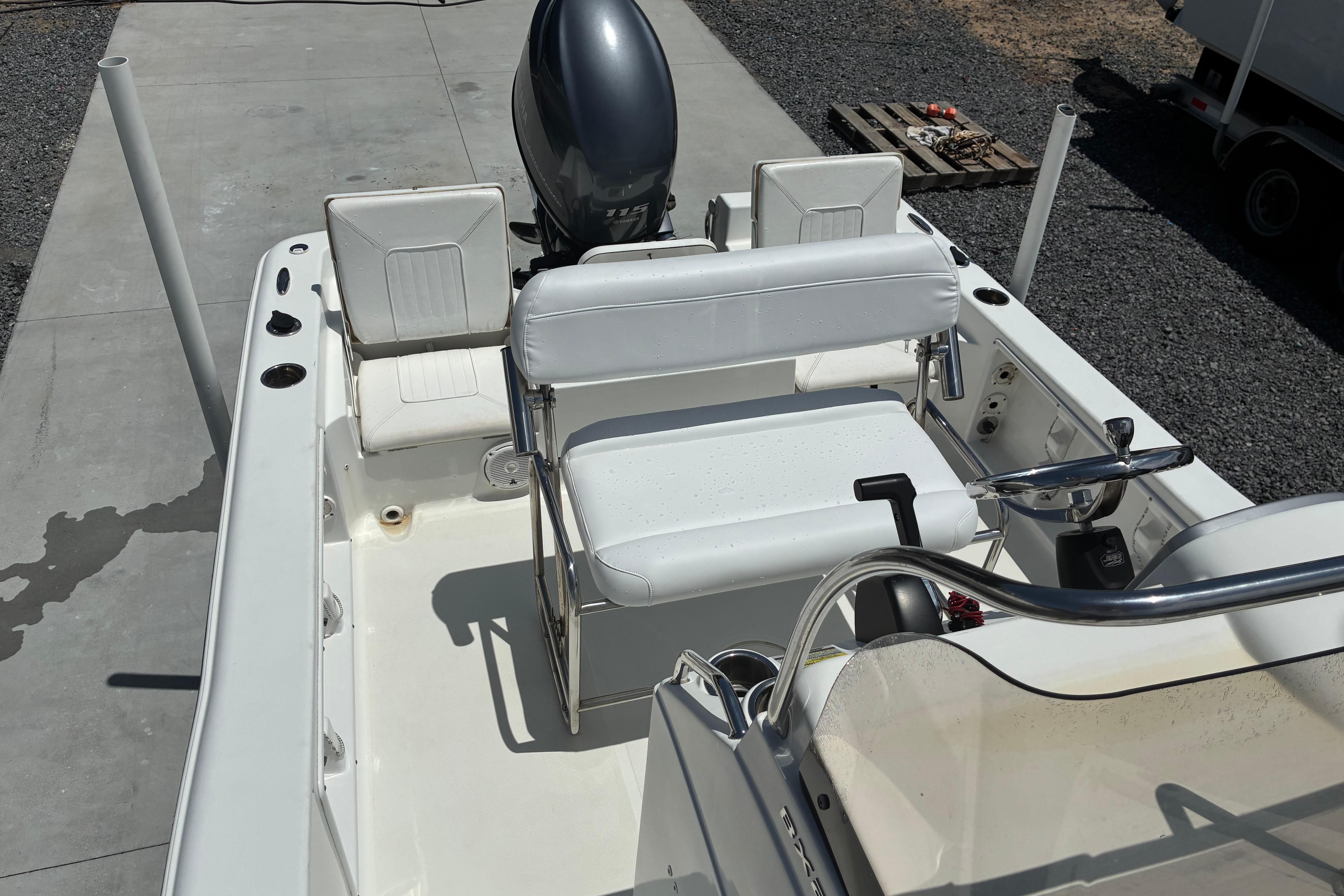 2014 Sea Hunt BX 20 BR boat interior with seating and steering console.