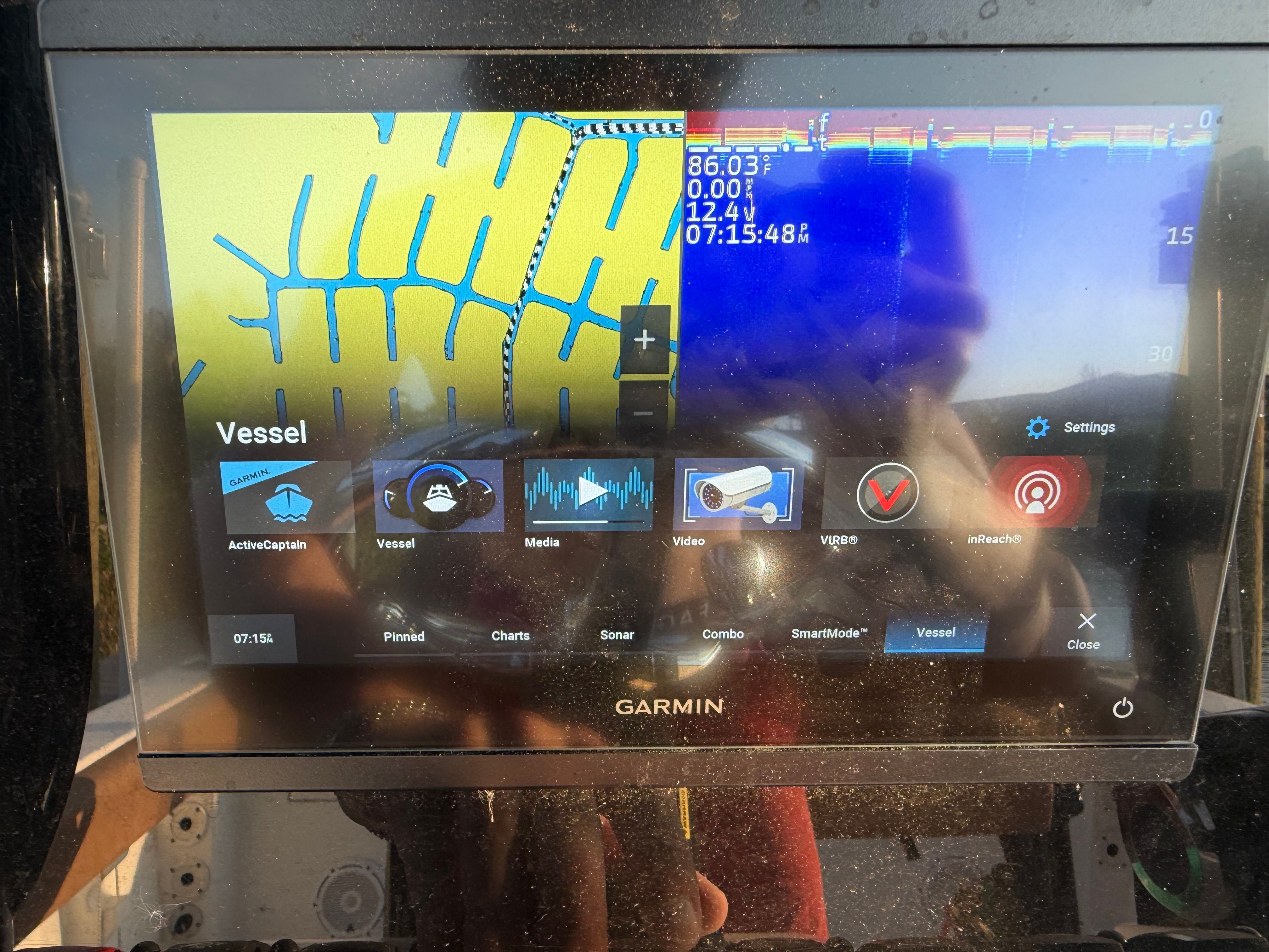 Garmin screen on a Sea Hunt Ultra 219 boat, displaying navigation and sonar data.