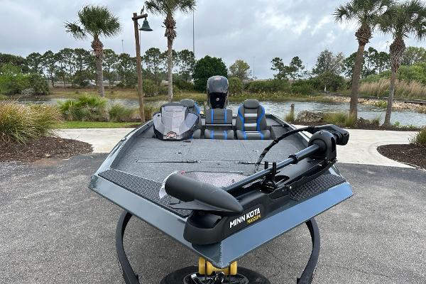 2025 Ranger RT188P boat with Minn Kota motor, parked near a scenic lake.